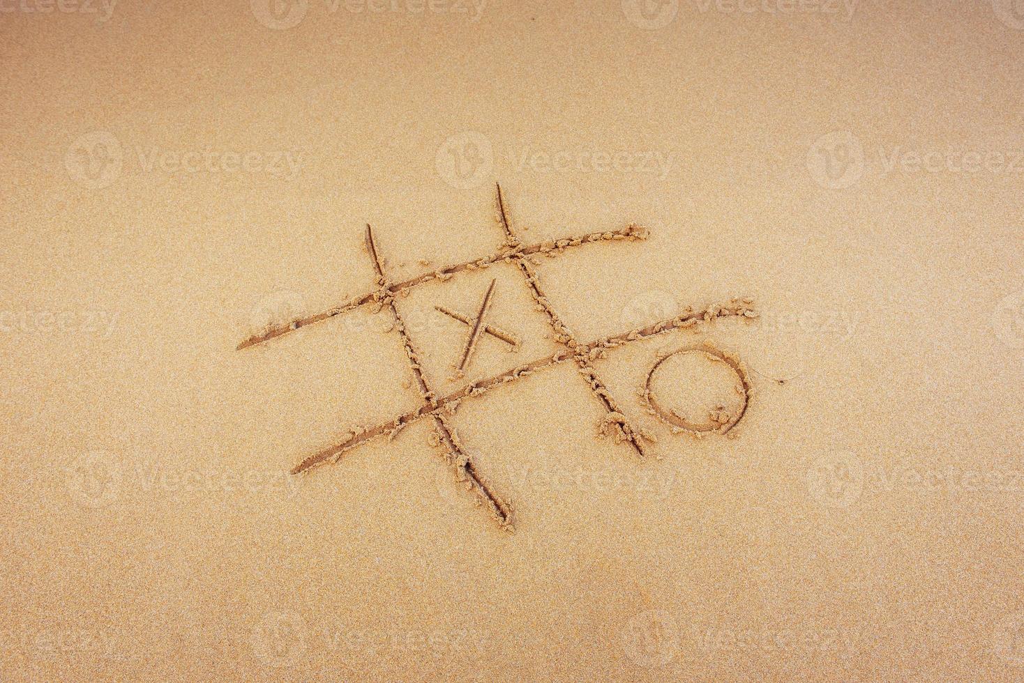 Figures in the sand on the beach photo