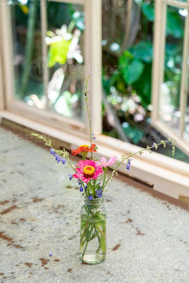 beautiful flower in vase decorated on table photo