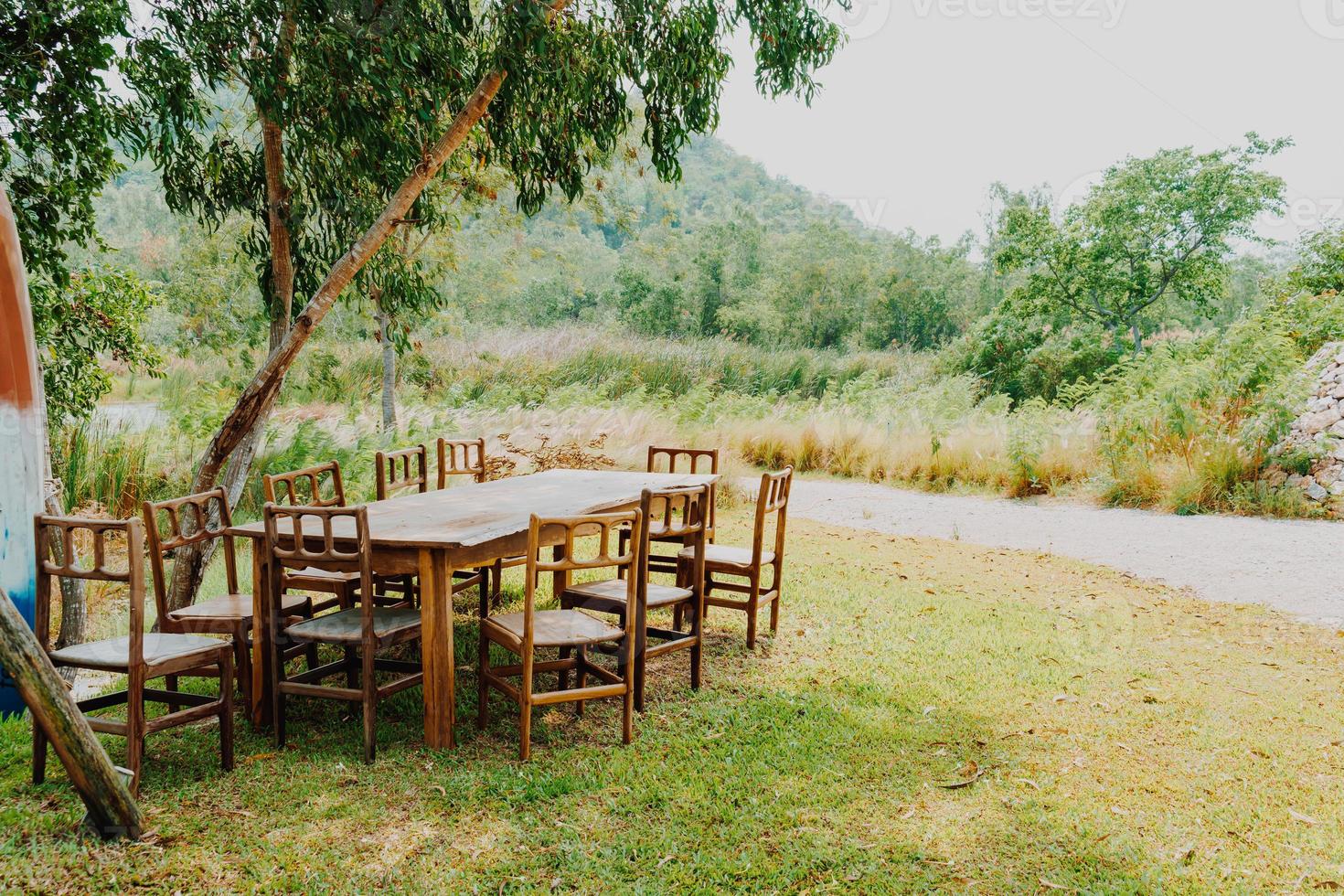 empty wood chair and table in garden photo