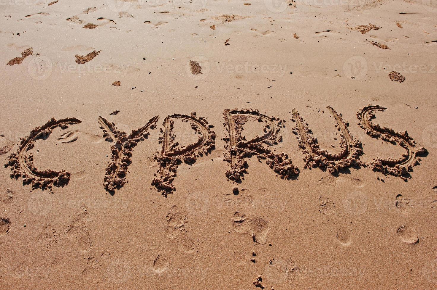 Cyprus written in the sand on the beach photo