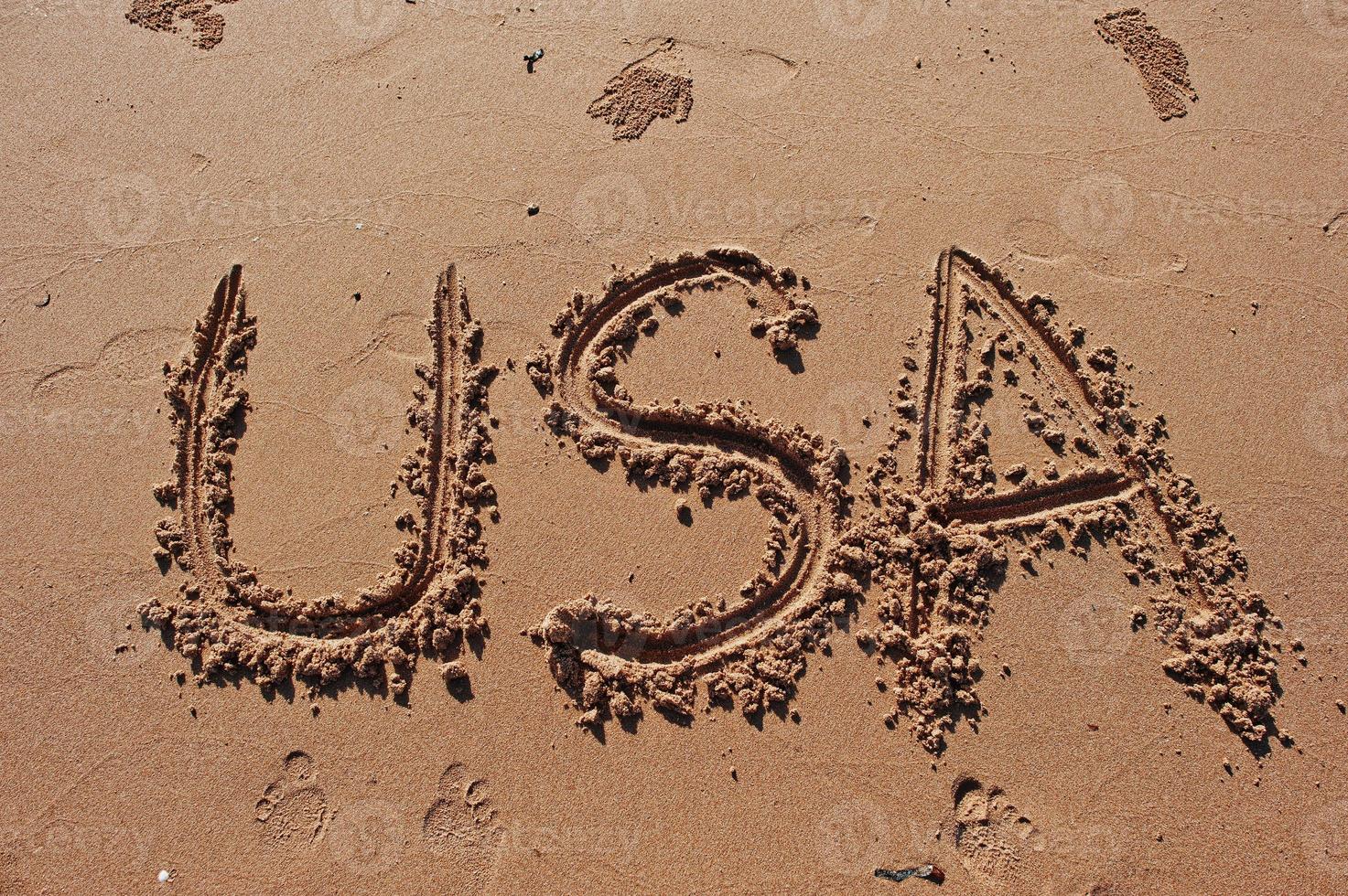 USA written in the sand on the beach photo