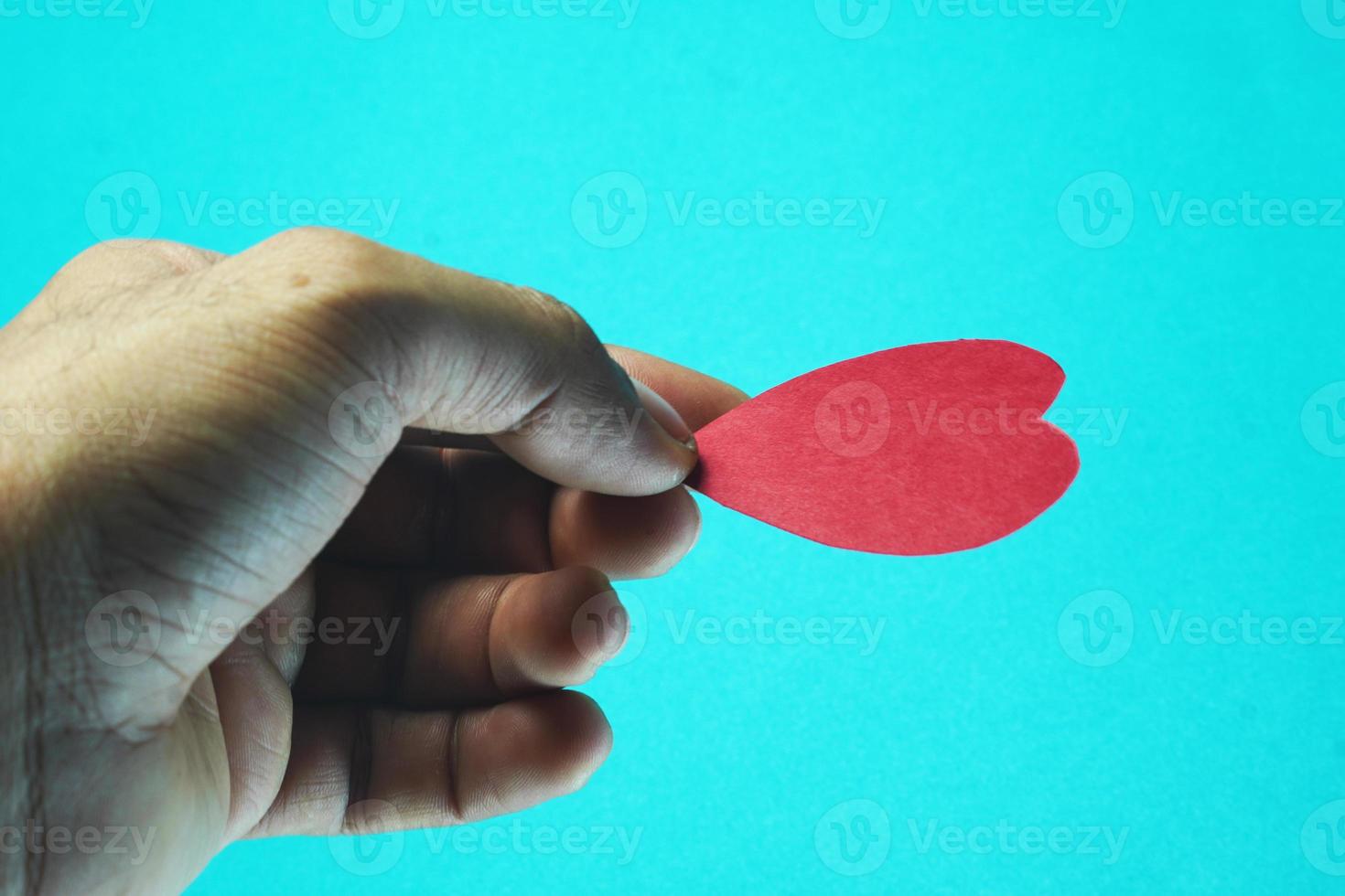 heart in hand on isolated background photo