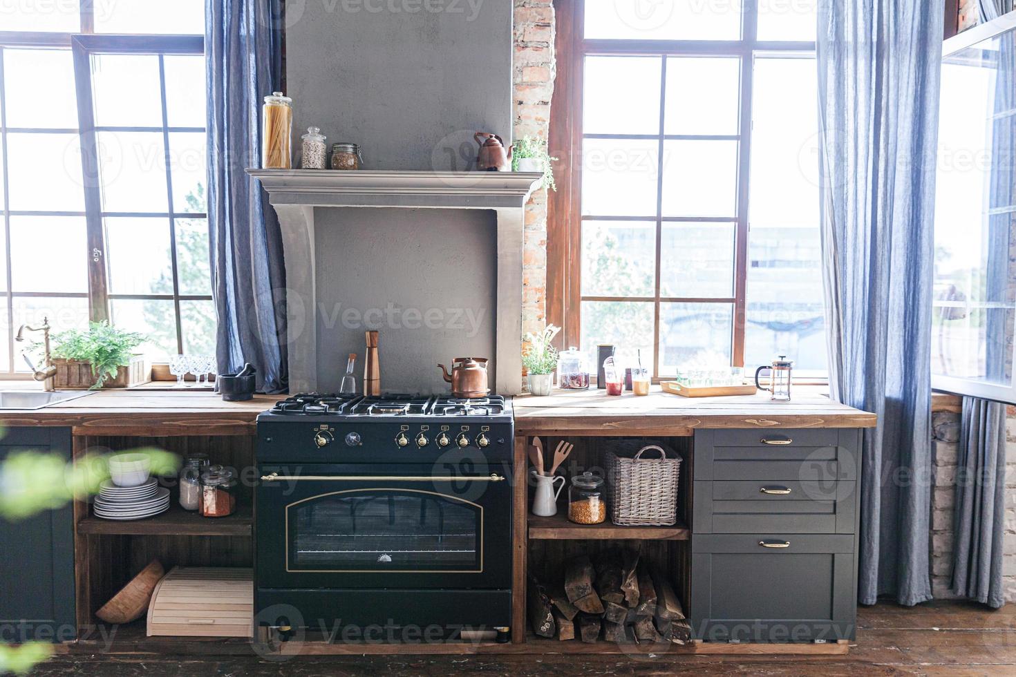 Scandinavian classic minimalistic dark gray kitchen with wooden details. Stylish loft modern gray kitchen decoration with clean contemporary style interior design. photo