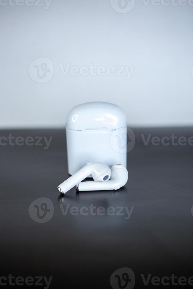 player with headphones on black background photo