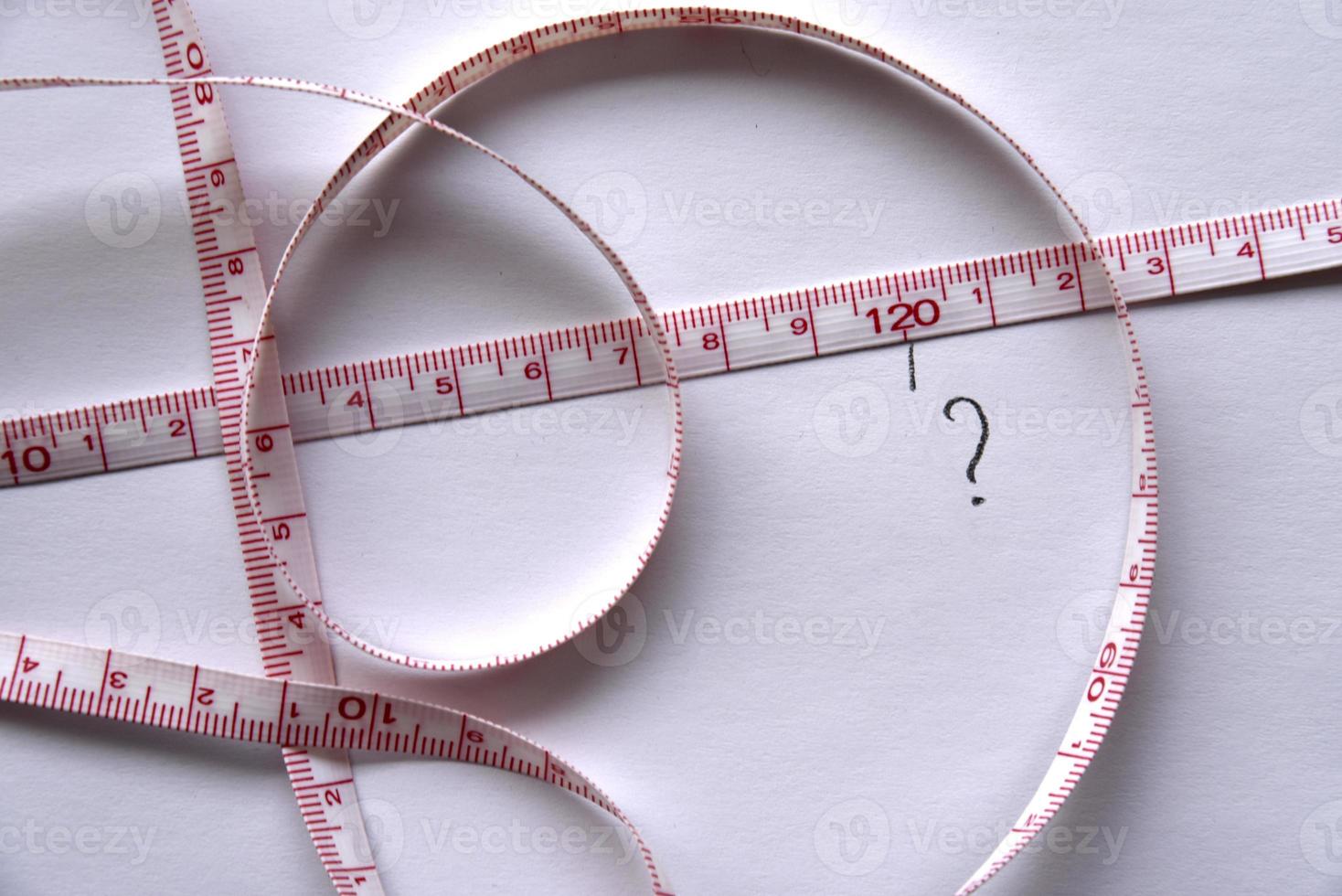 Sewing centimeter centimeter tape tailor's meter measuring tape on a white background photo