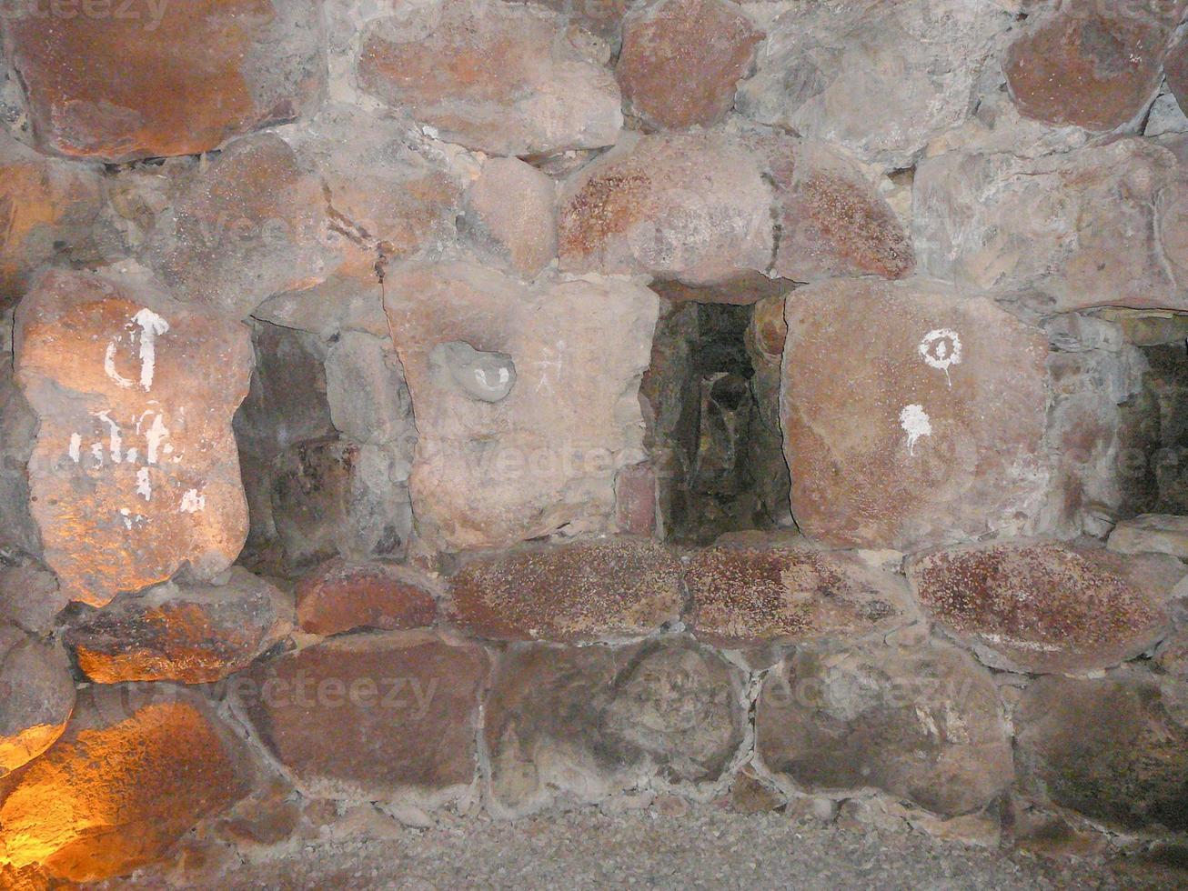 Ruins of ancient Sunuxi Nuraghe megalithic building in Sardinia, photo