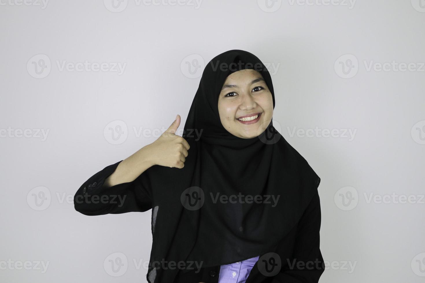 Ok sign with smile asian islamic business women standing confidence. photo