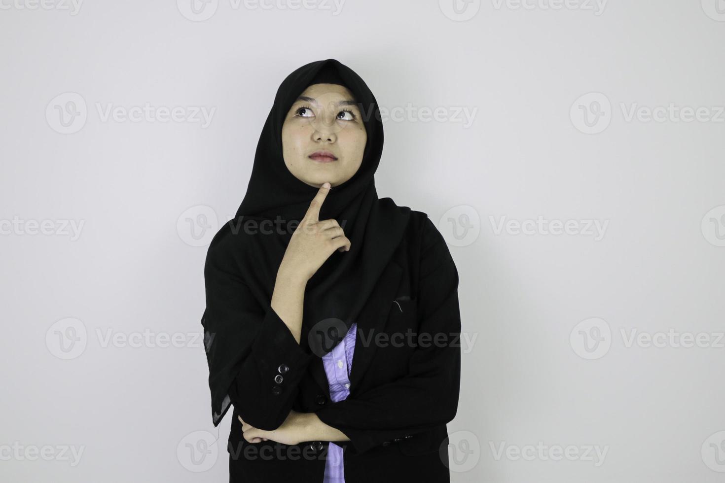 Serious daydreaming gesture Young Asian Islam woman wearing headscarf. photo