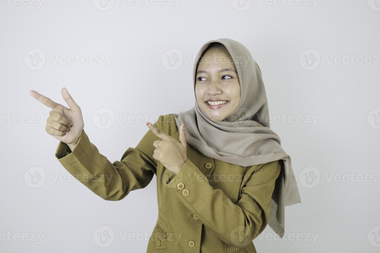 Smile government worker women pointing beside. PNS wearing khaki uniform. photo