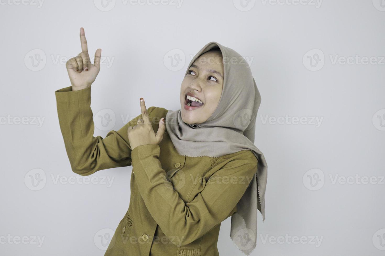 Smile government worker women pointing above. PNS wearing khaki uniform. photo