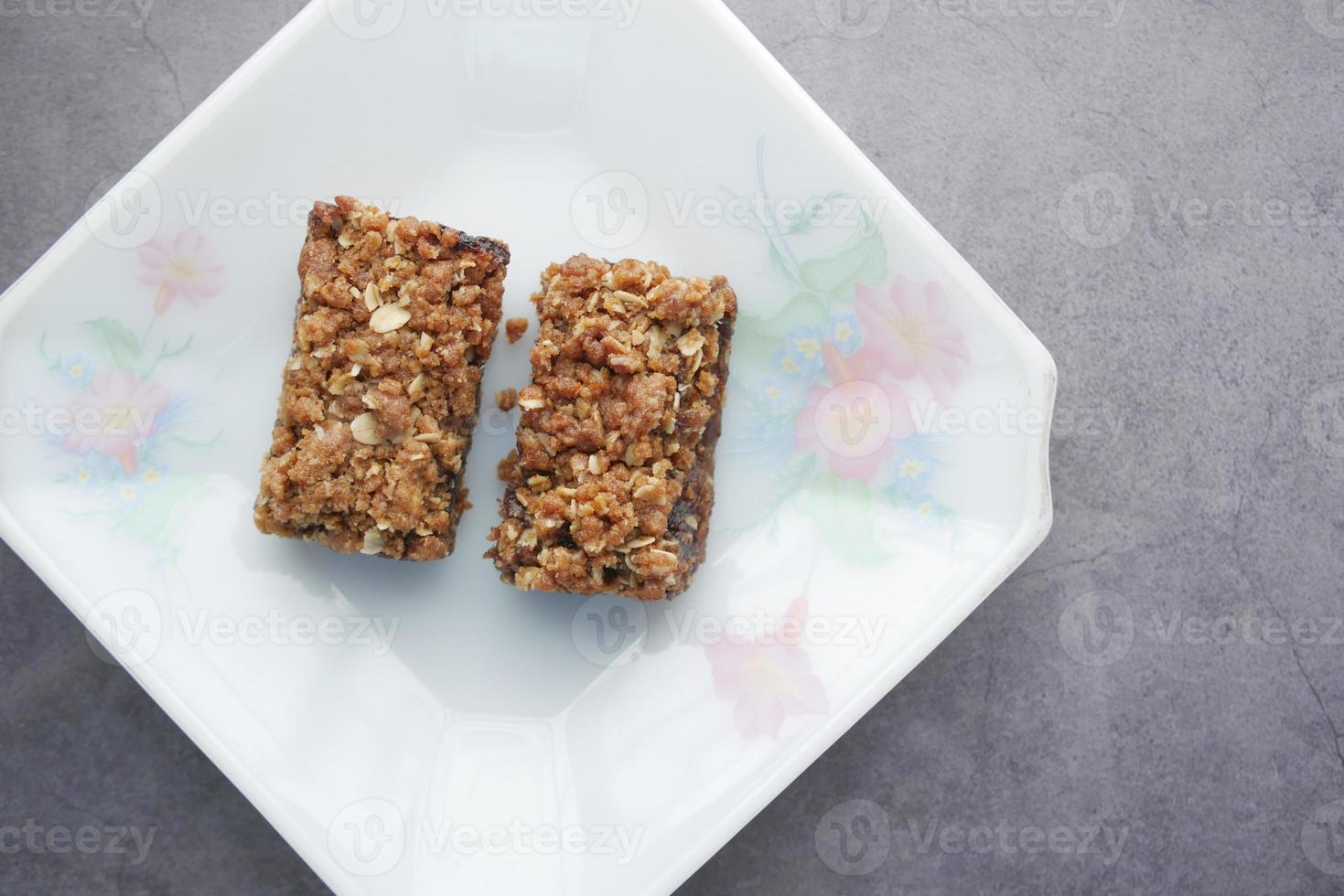 date fruit chocolate bar in a plate on table photo