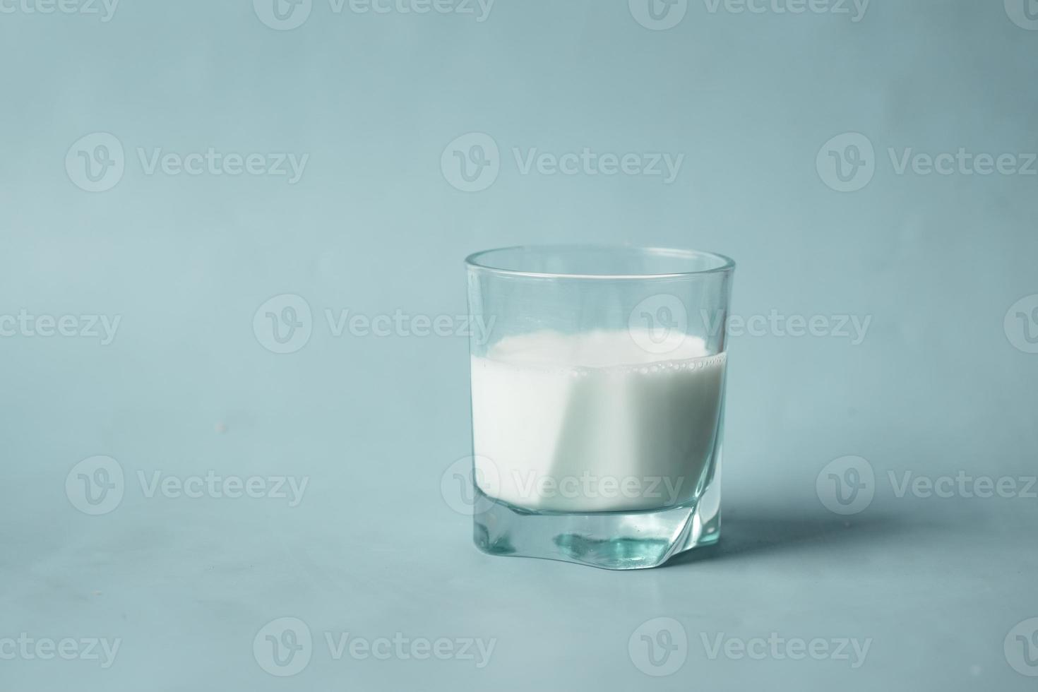 glass of fresh milk on table photo