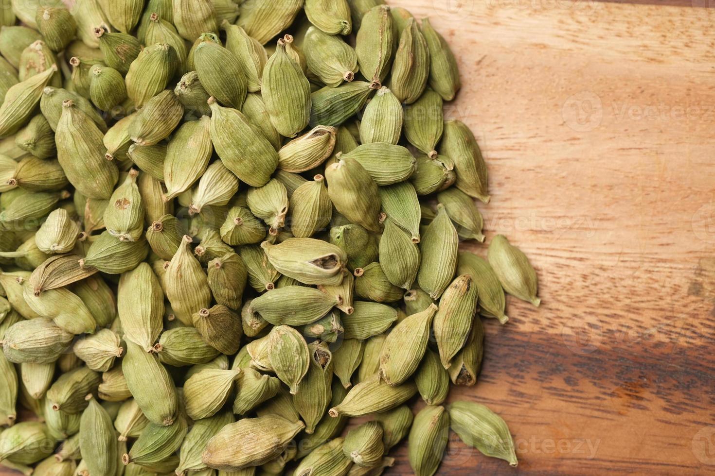 close up of Cardamom on a chopping board on table photo
