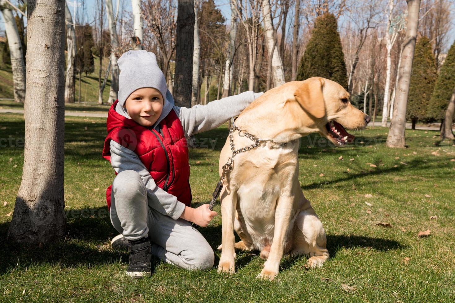 boy walking with a pet photo