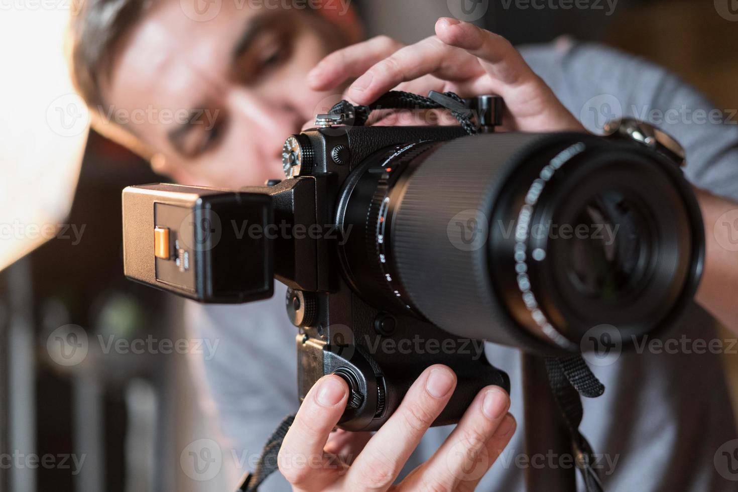 photographer in the process of shooting in the Studio photo