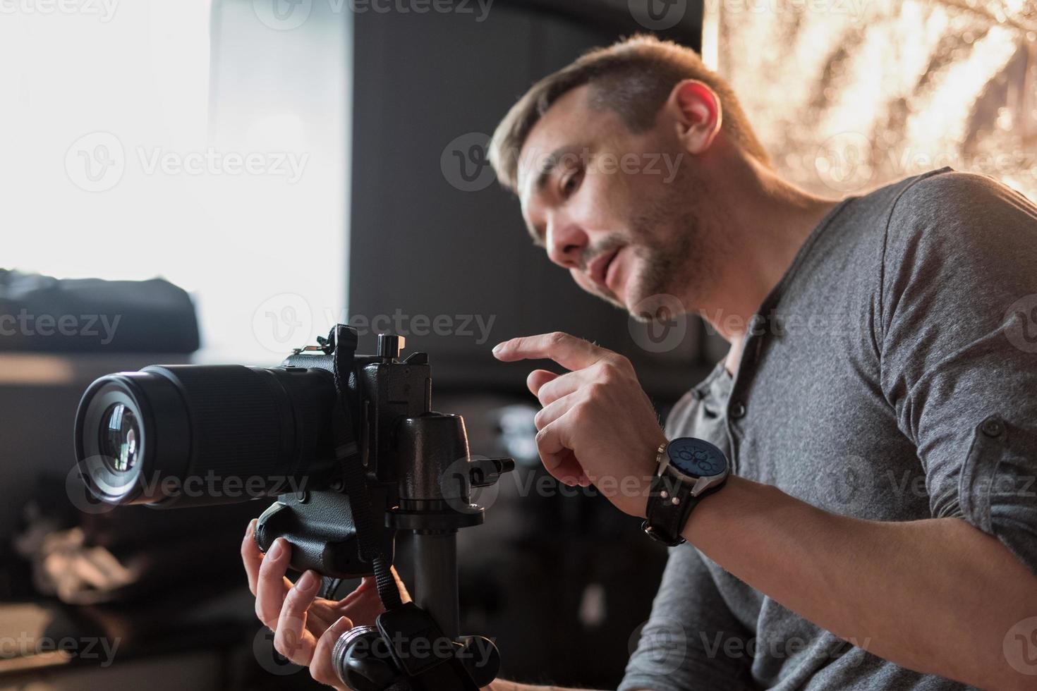 photographer in the process of shooting in the Studio photo