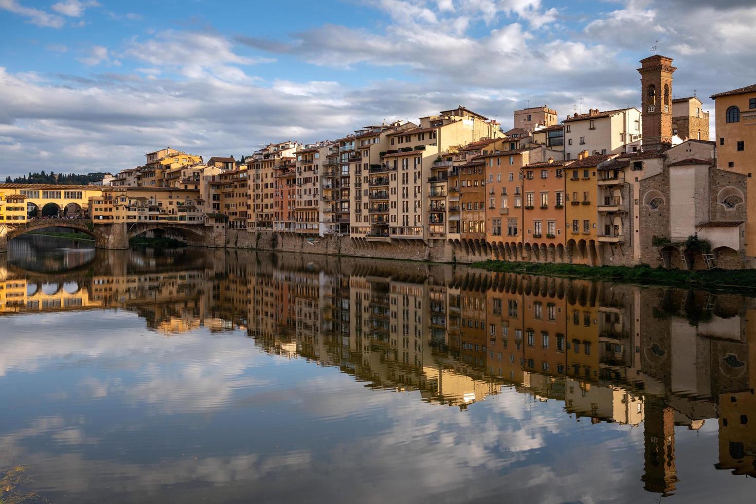 FLORENCE, TUSCANY, ITALY - OCTOBER 18. View of buildings along and across the River Arno in Florence  on October 18, 2019. Unidentified people. photo