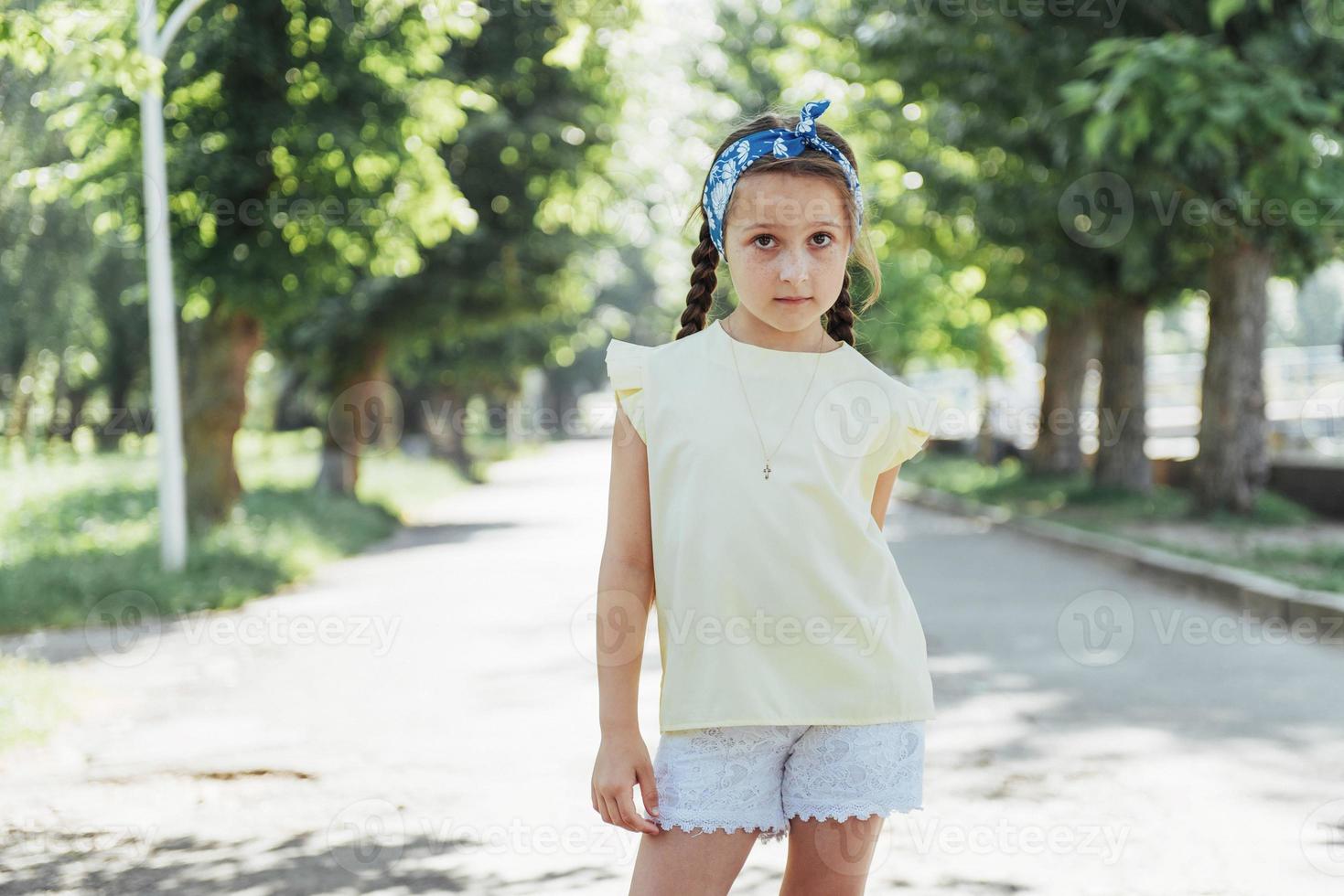 Beautiful girl in a summer sunny day photo