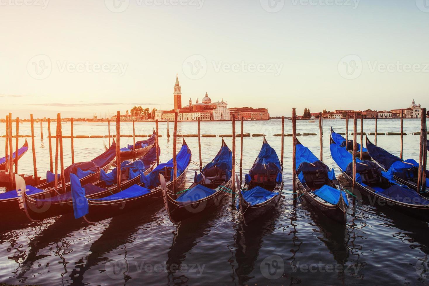 City landscape. Green water with gondolas and colorful facades o photo