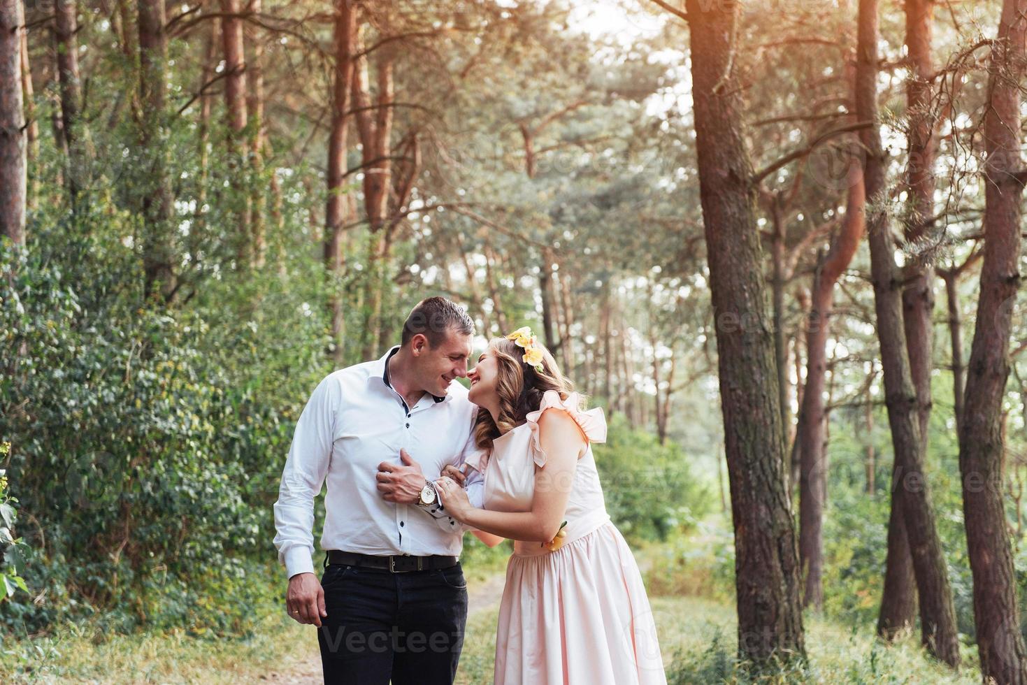 Happy couple in a pine forest Beauty world photo