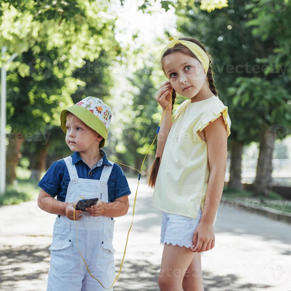 Cute girl and boy listening to music photo