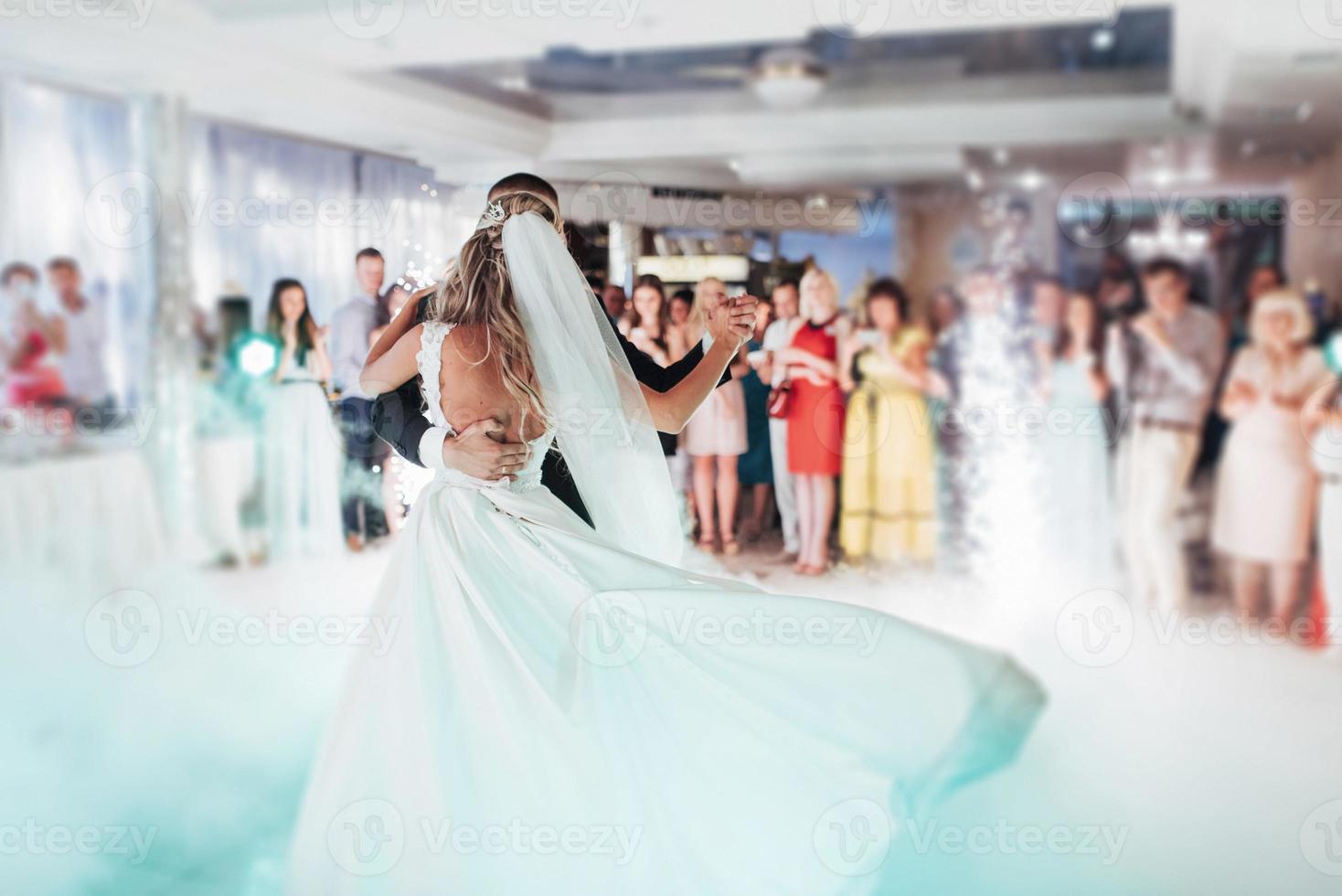 Happy bride and groom their first dance photo