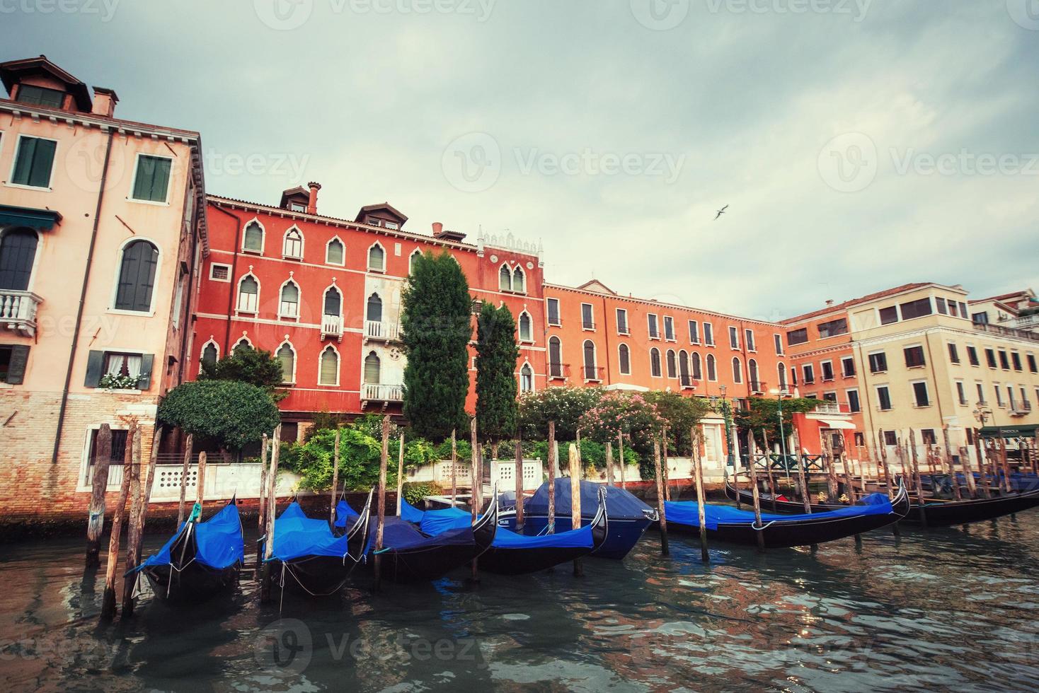 City landscape. Green water with gondolas and colorful facades o photo