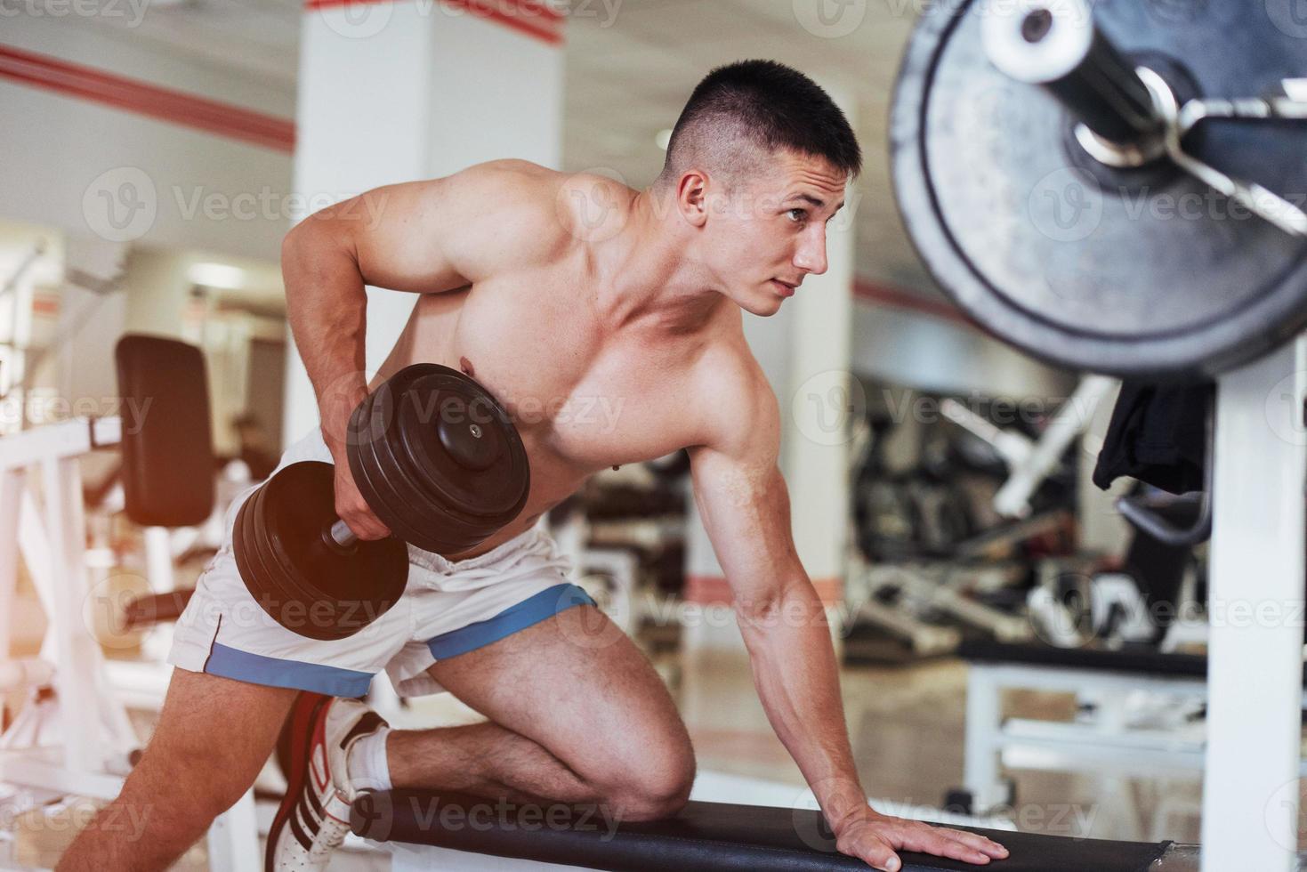 Beautiful man with big muscles, posing for the camera photo