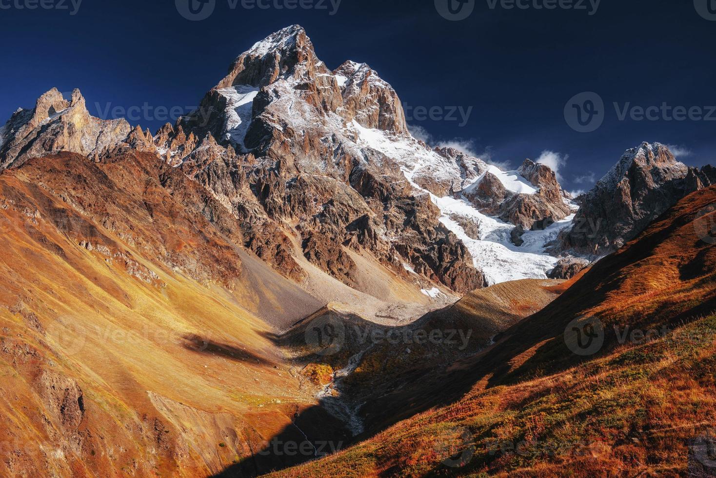 Fantastic scenery and snowy peaks in the first morning sunlight. photo