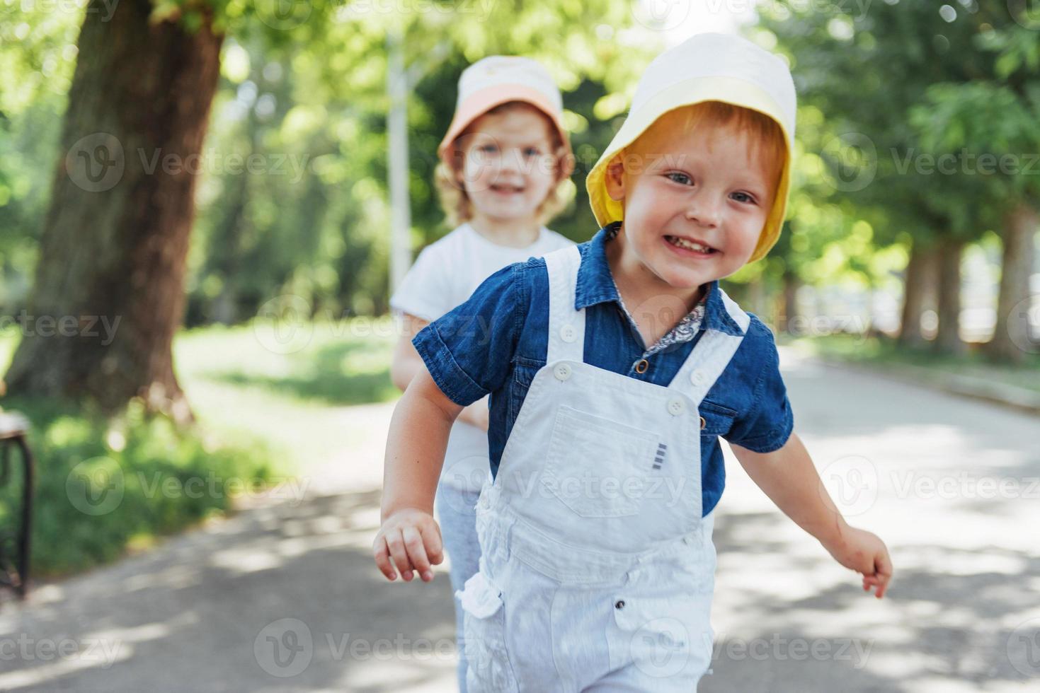 portrait of a little girl and her brother. photo