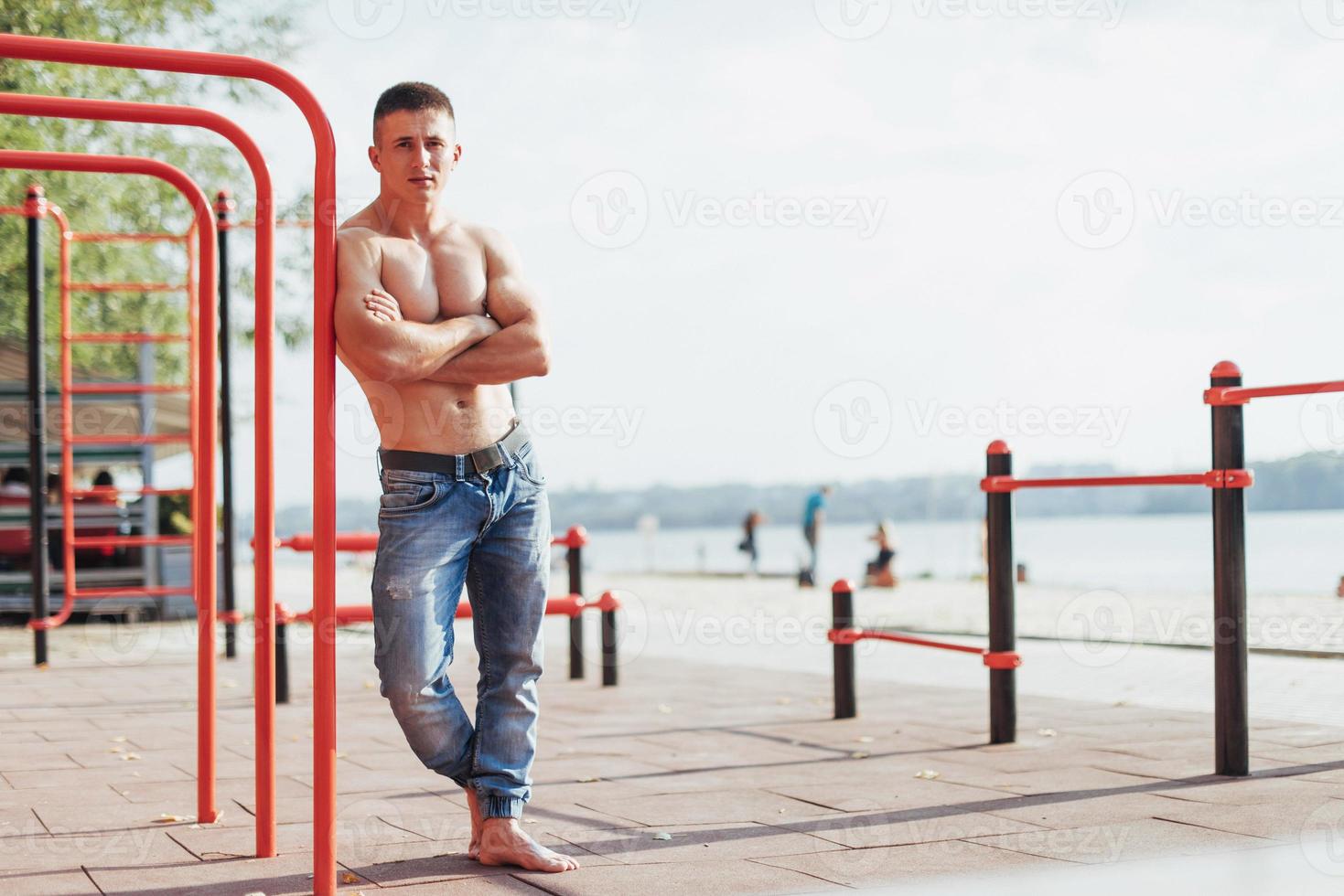 Strong young athlete engaged on the playground photo