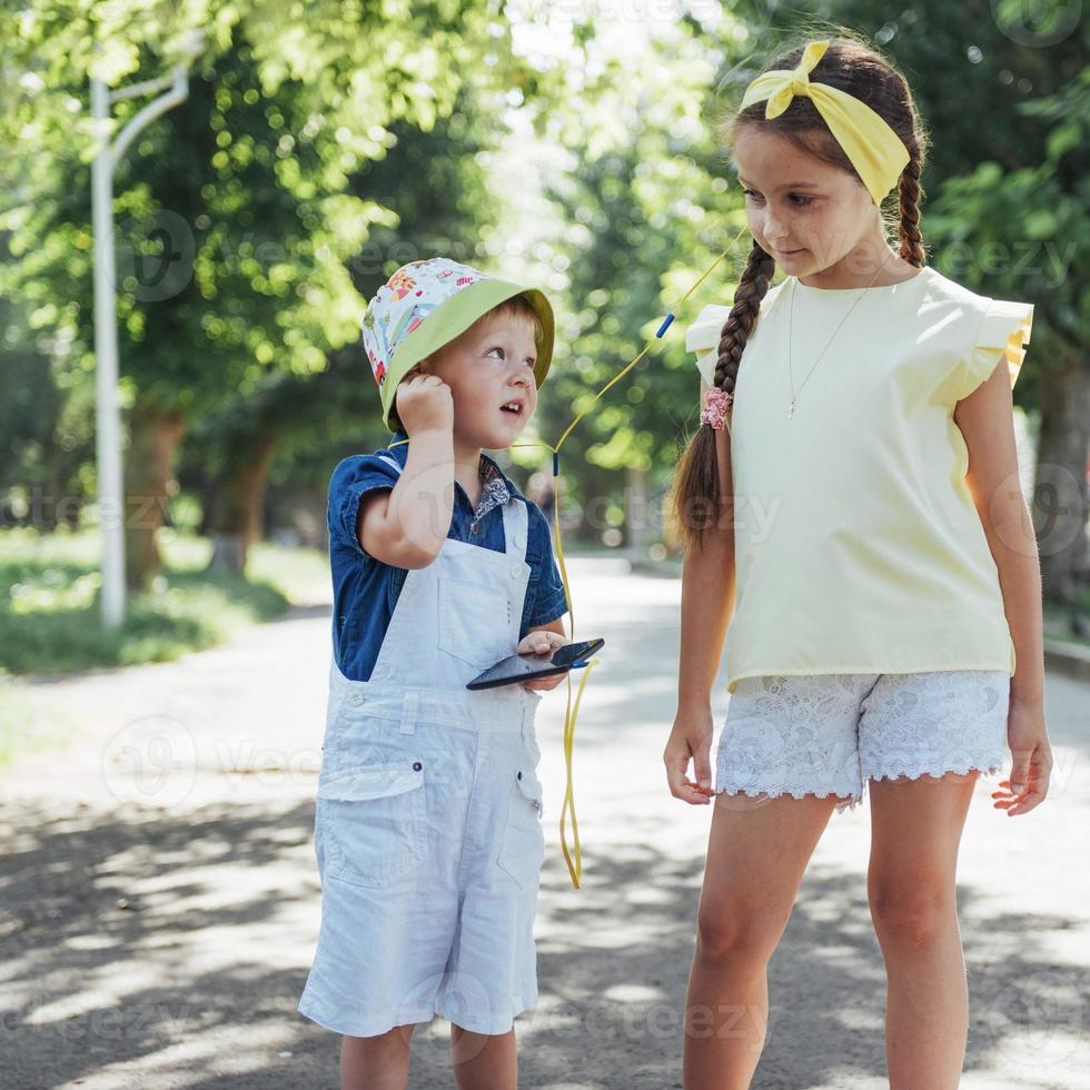 Cute girl and boy listening to music photo