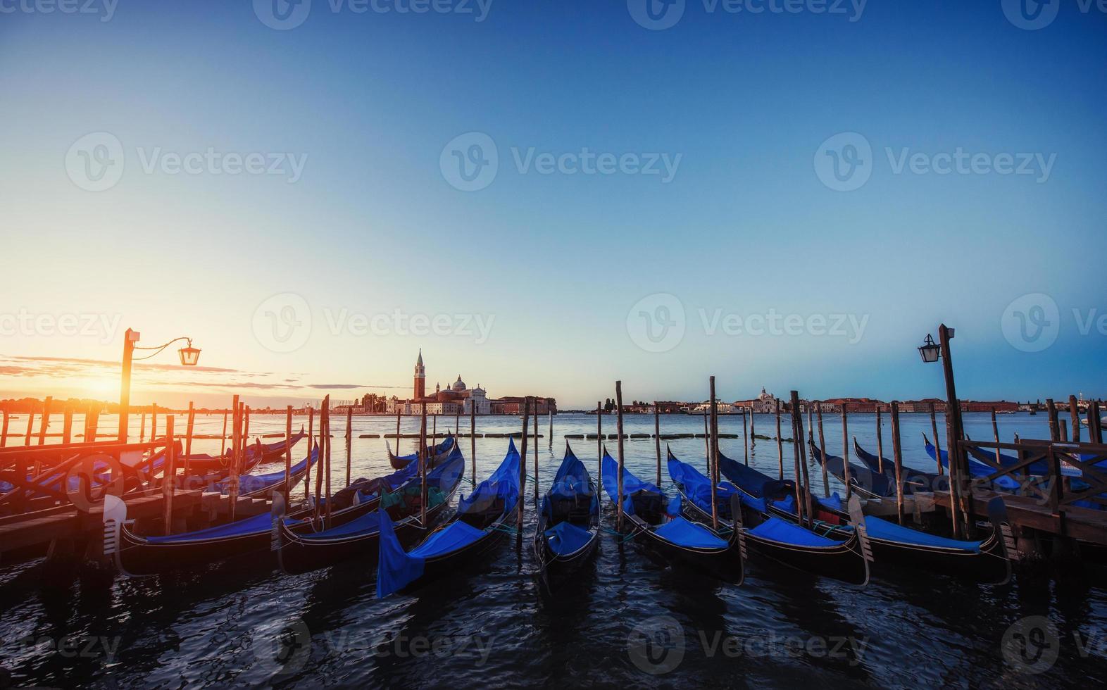 City landscape. Fantastic views of the gondola at sunset, moored photo