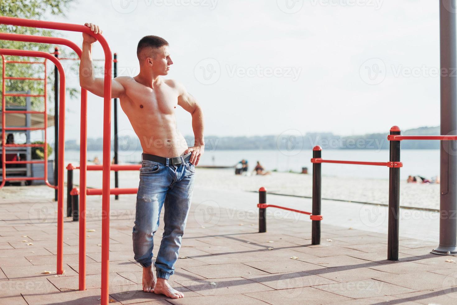 Strong young athlete engaged on the playground photo