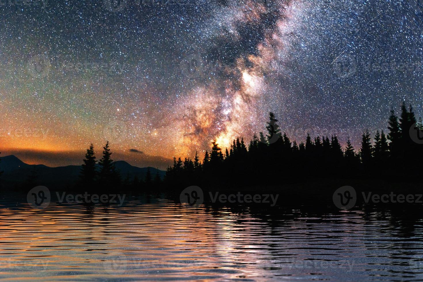 Starry sky over the sea. Fantastic Milky Way. Meteor shower photo