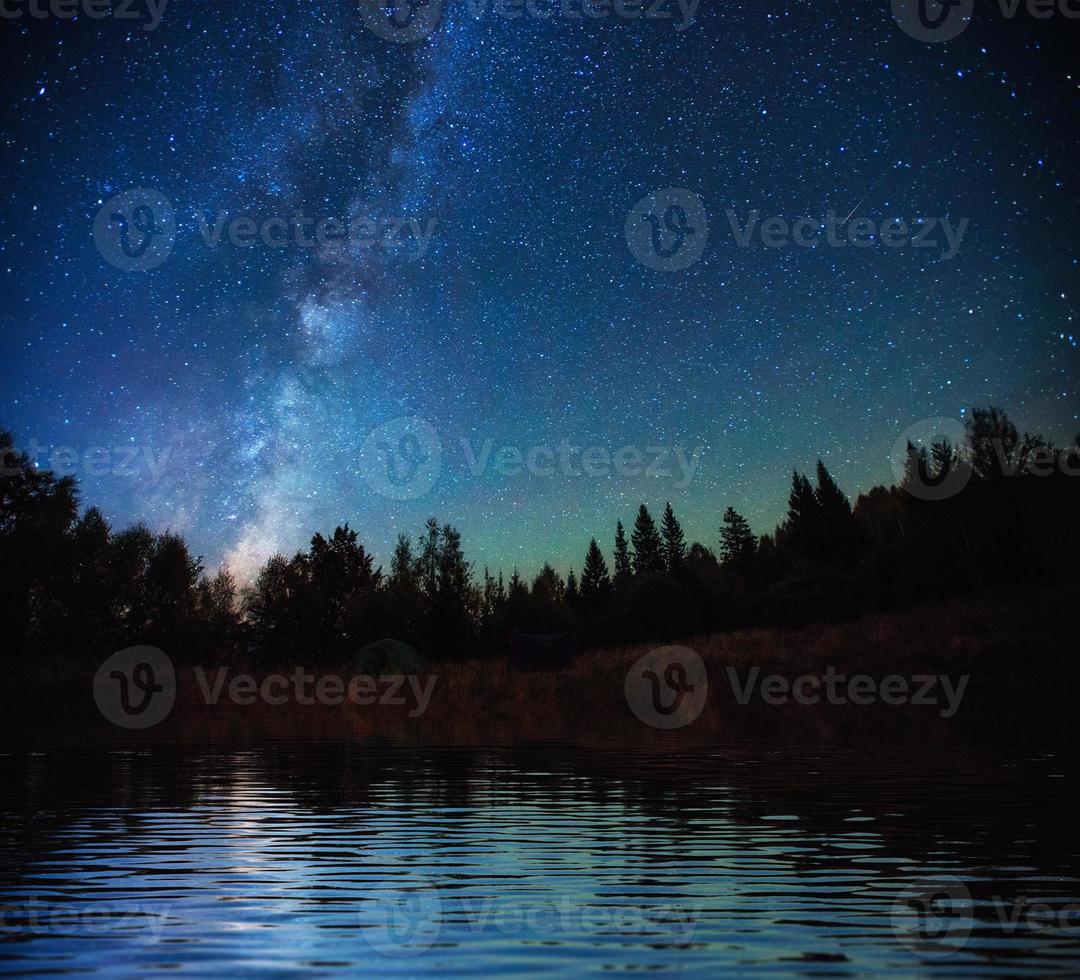 Starry sky over the sea. Fantastic Milky Way. Meteor shower photo