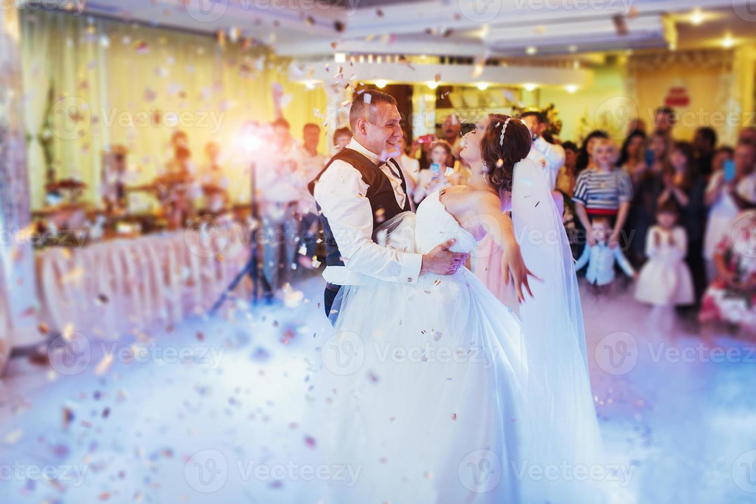 Happy bride and groom their first dance photo