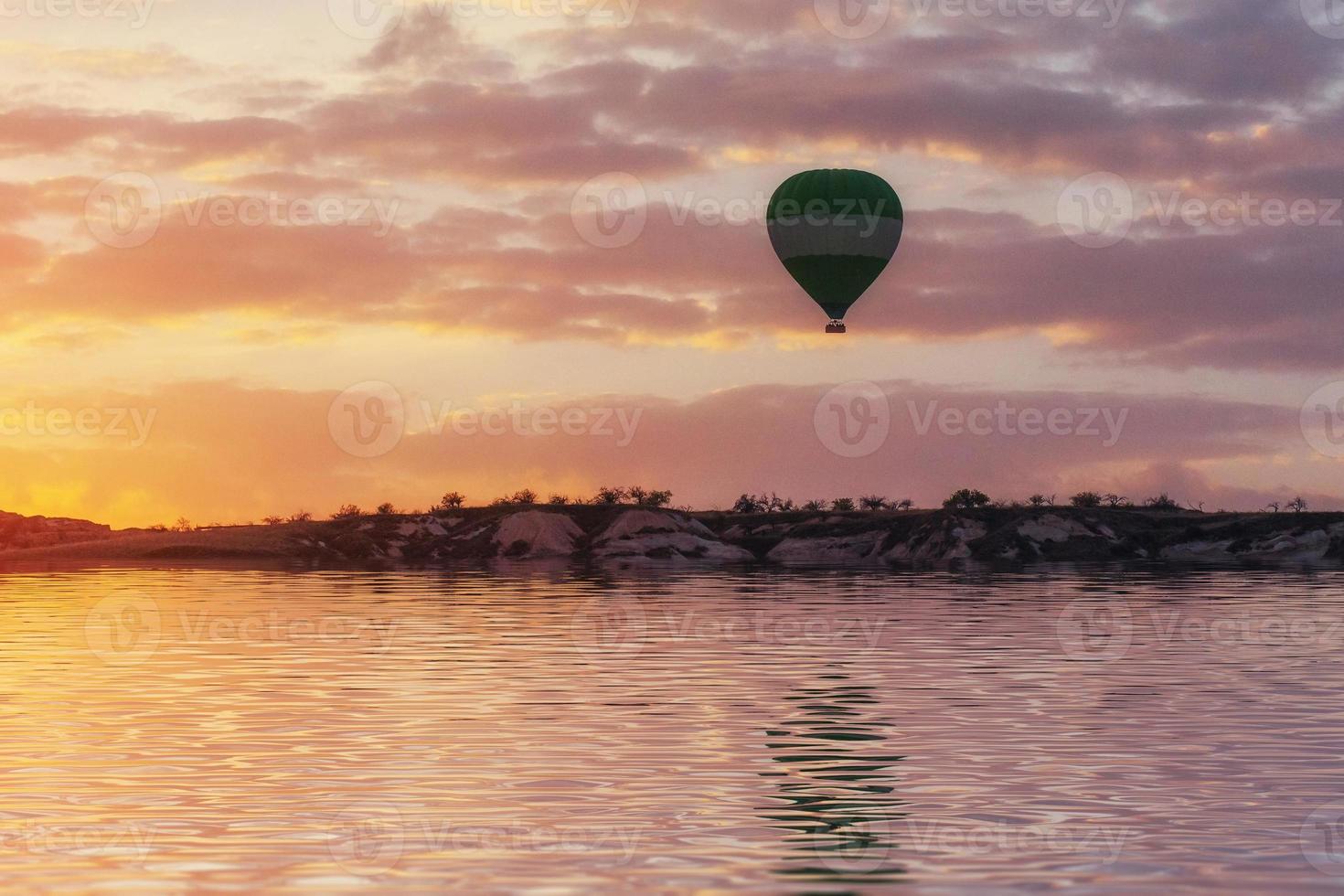 Composition of balloons over water and valleys, gorges, hills, b photo