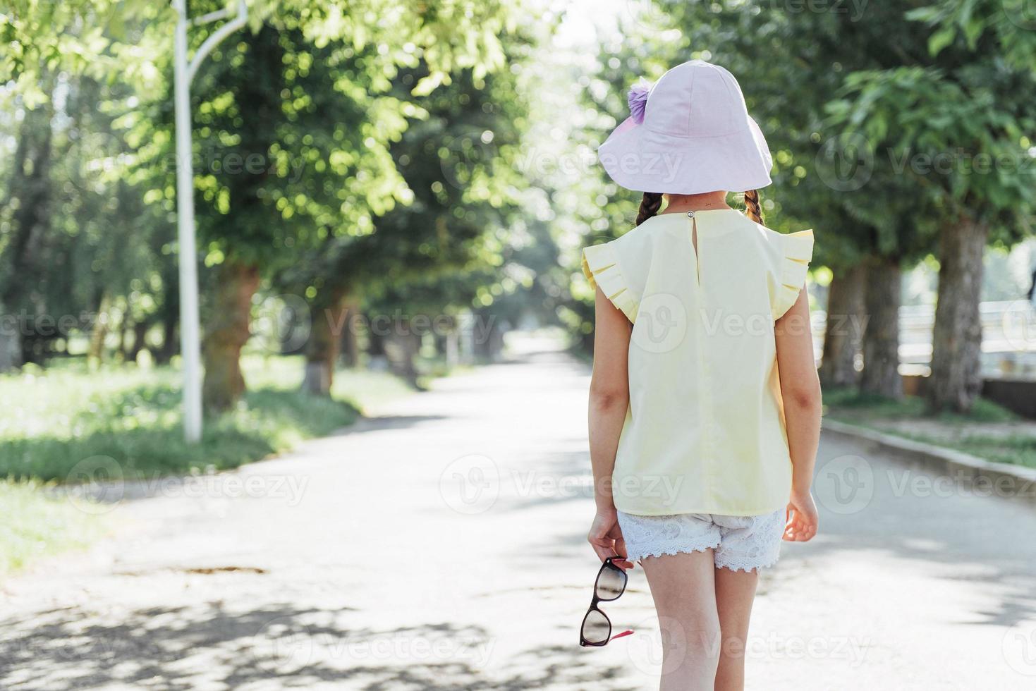 Beautiful girl in a summer sunny day photo
