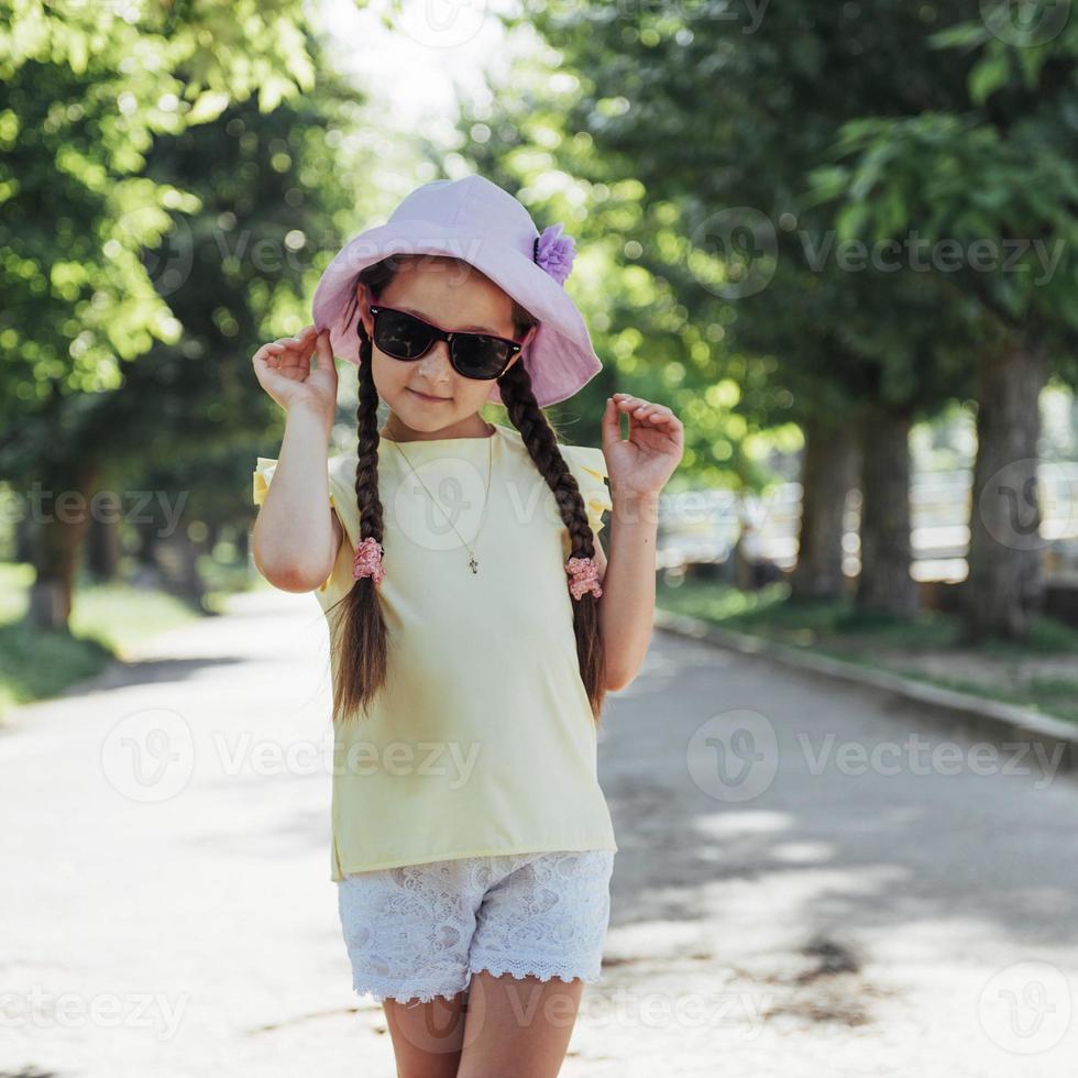 Beautiful girl in a summer sunny day photo