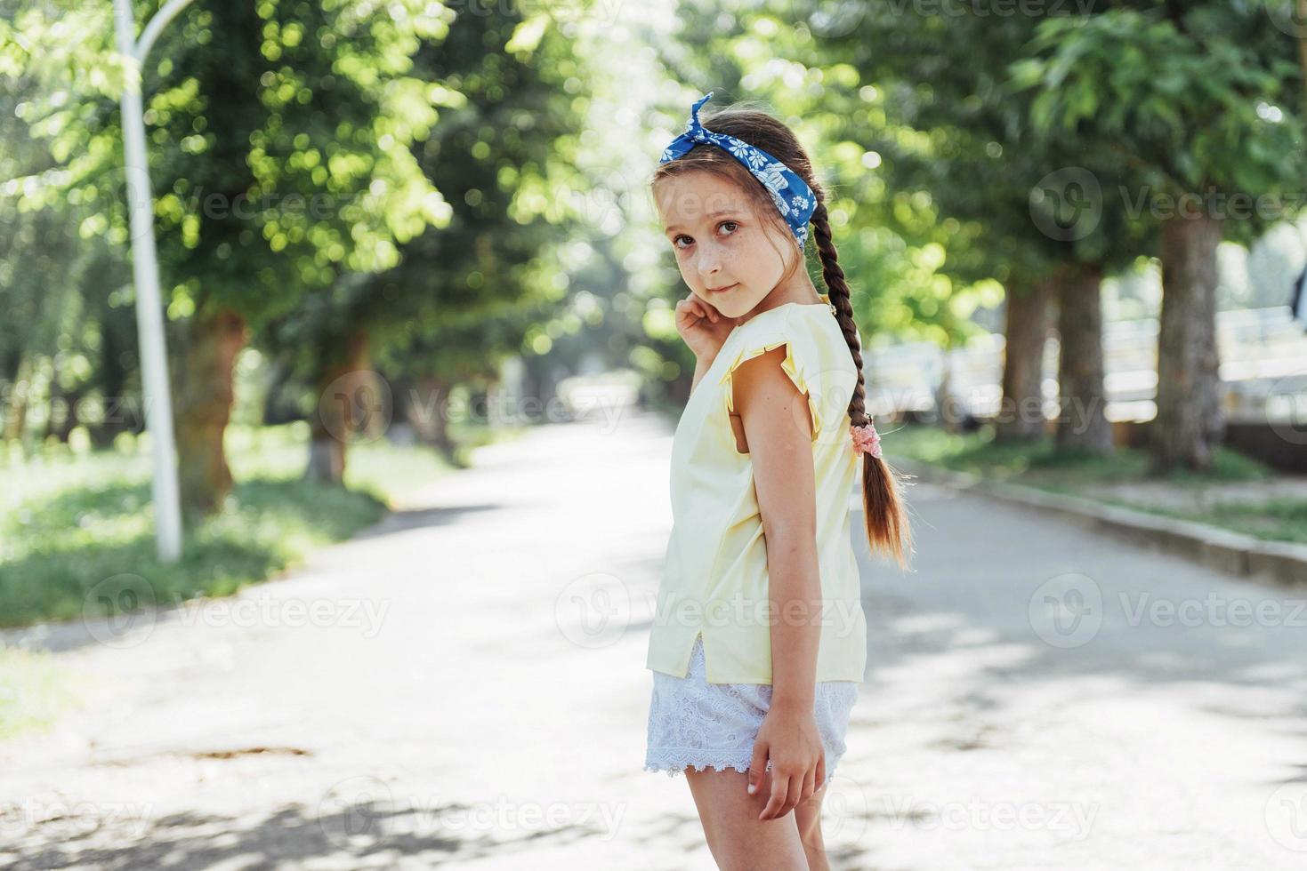 Beautiful girl in a summer sunny day photo