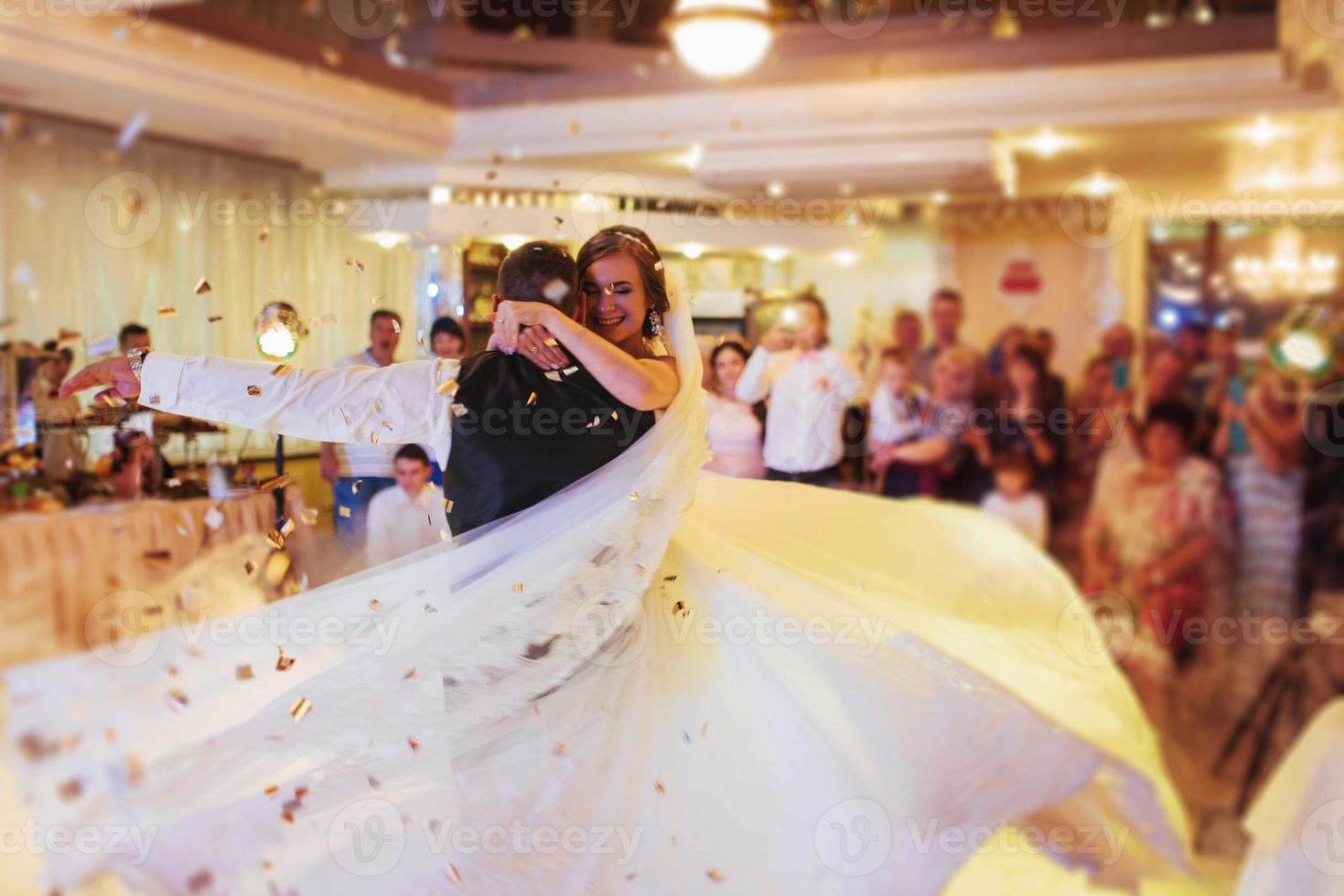 Happy bride and groom their first dance photo