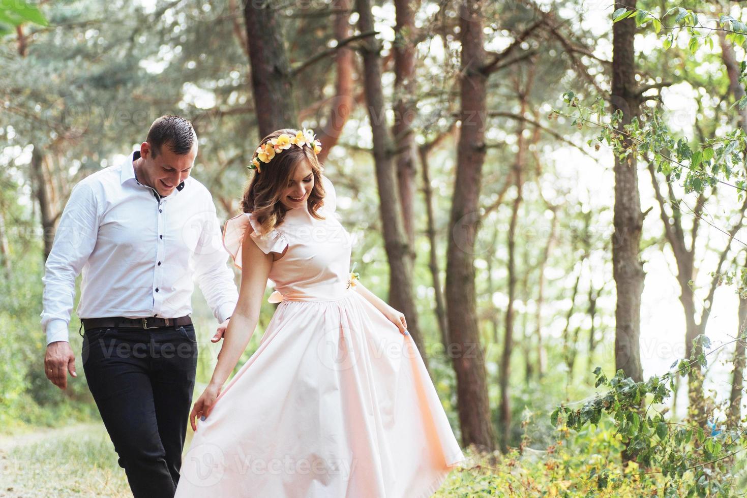 Happy couple in a pine forest Beauty world photo