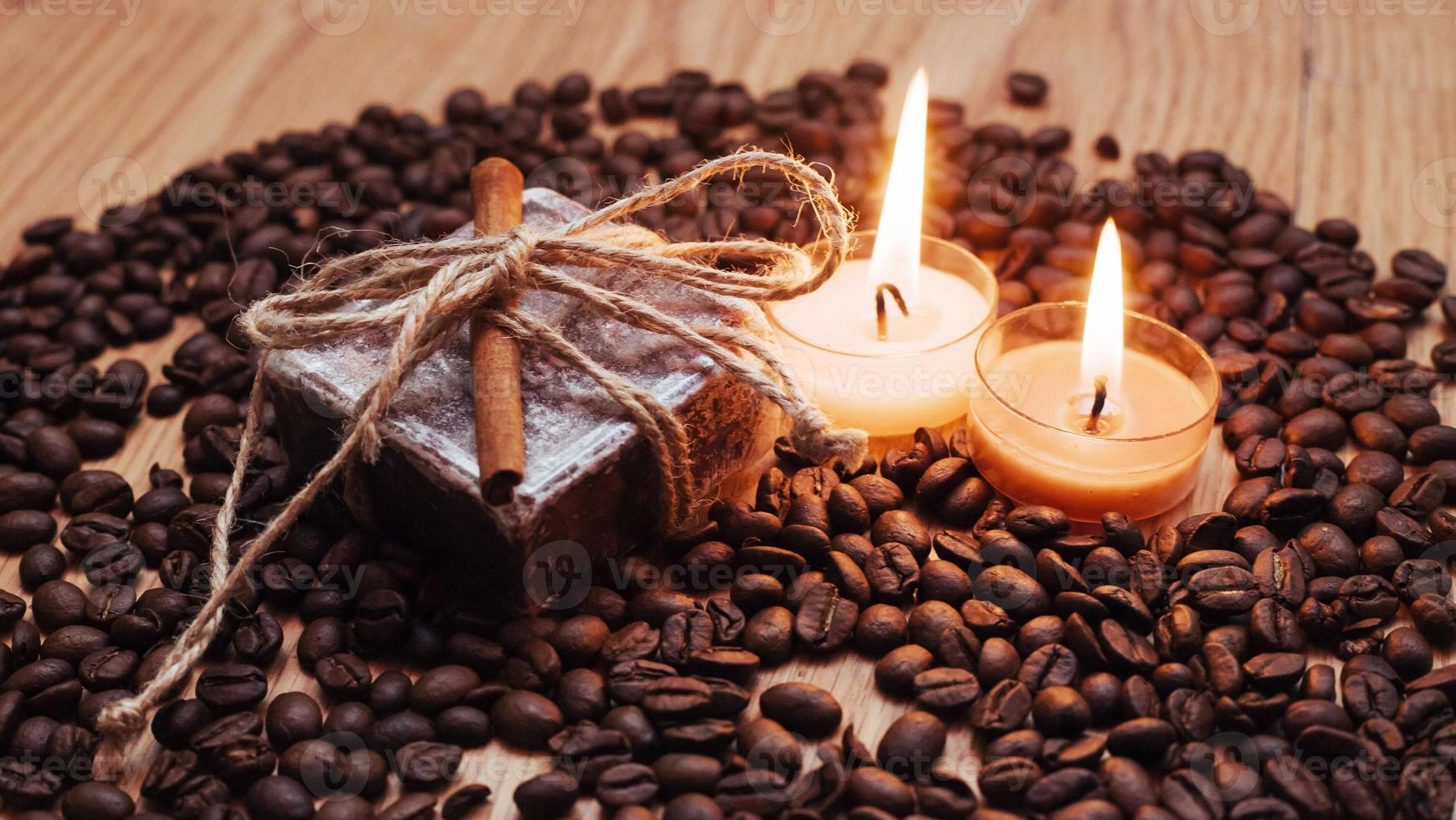 Burning aromatic coffee candle and beans, close-up photo