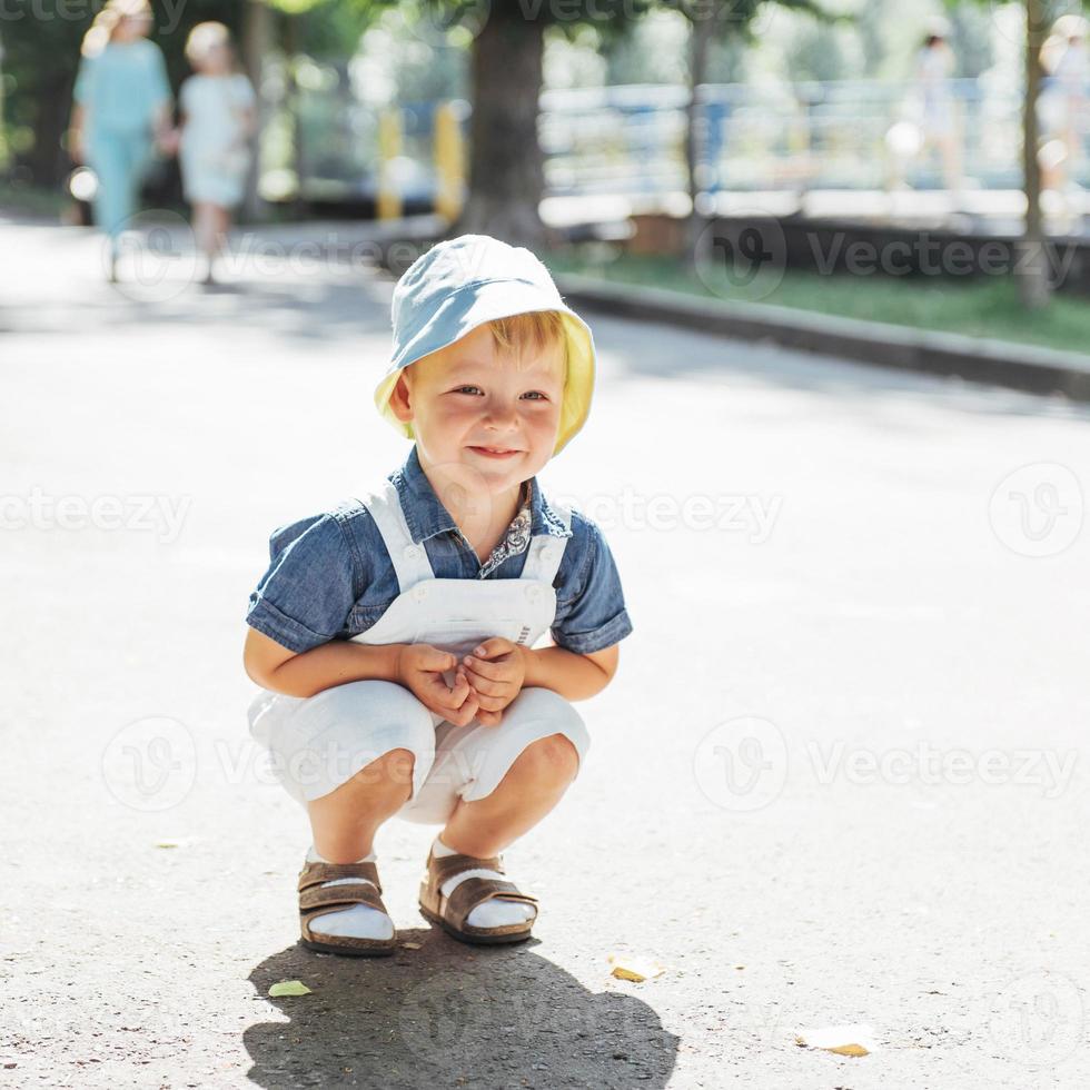 Cute boy posing for photo outdoors.