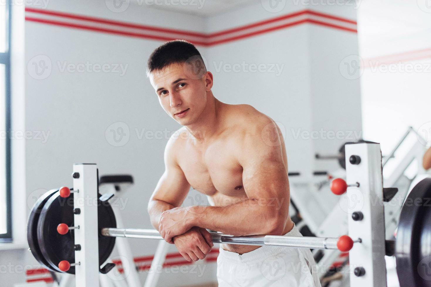 Beautiful man with big muscles, posing for the camera photo