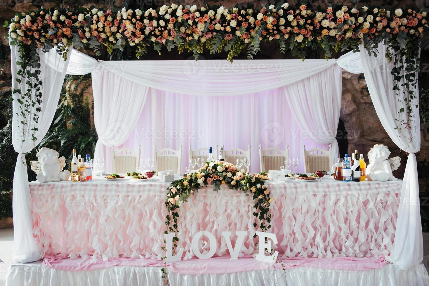 luxurious decorated table in the main hall wedding photo