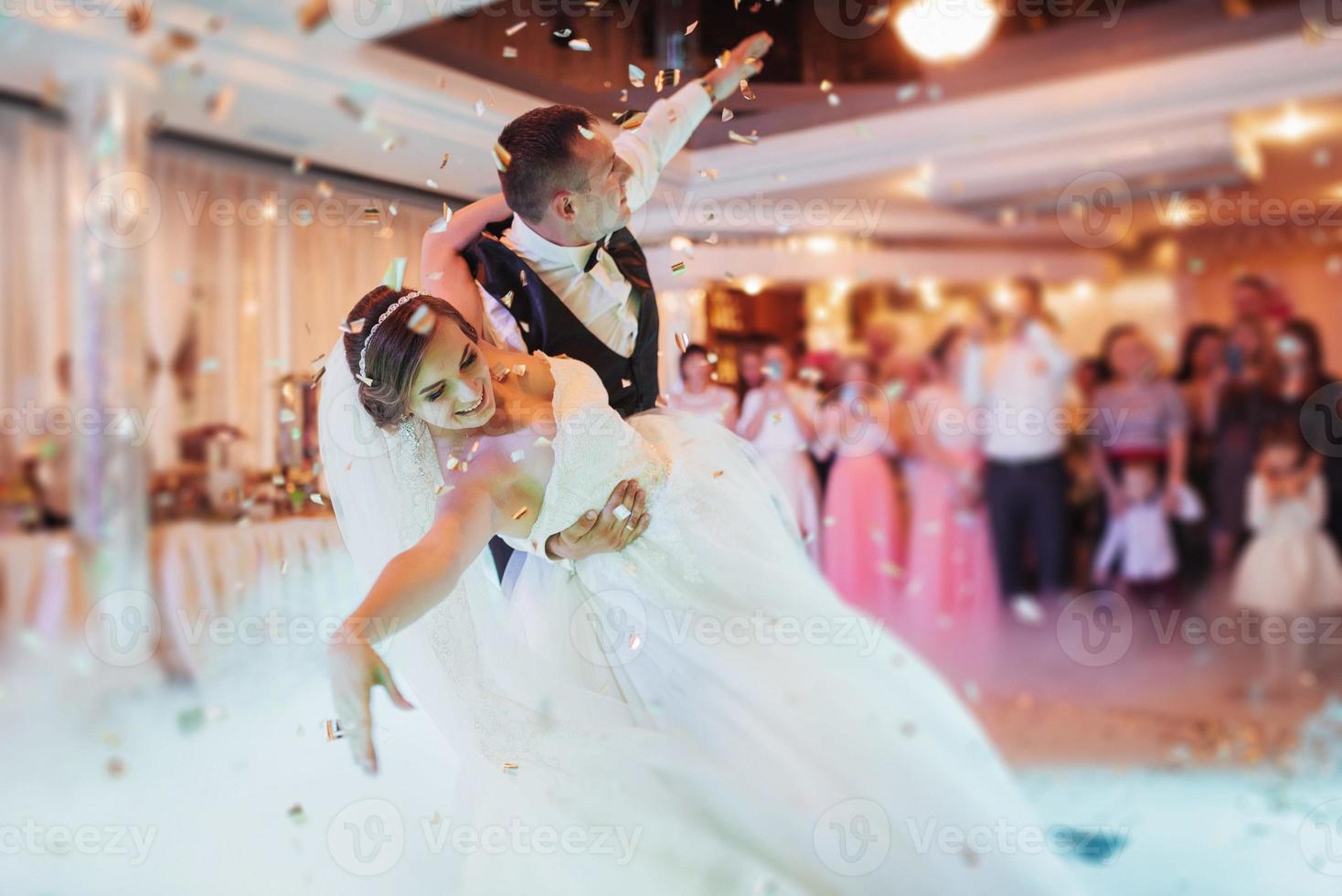 Happy bride and groom their first dance photo