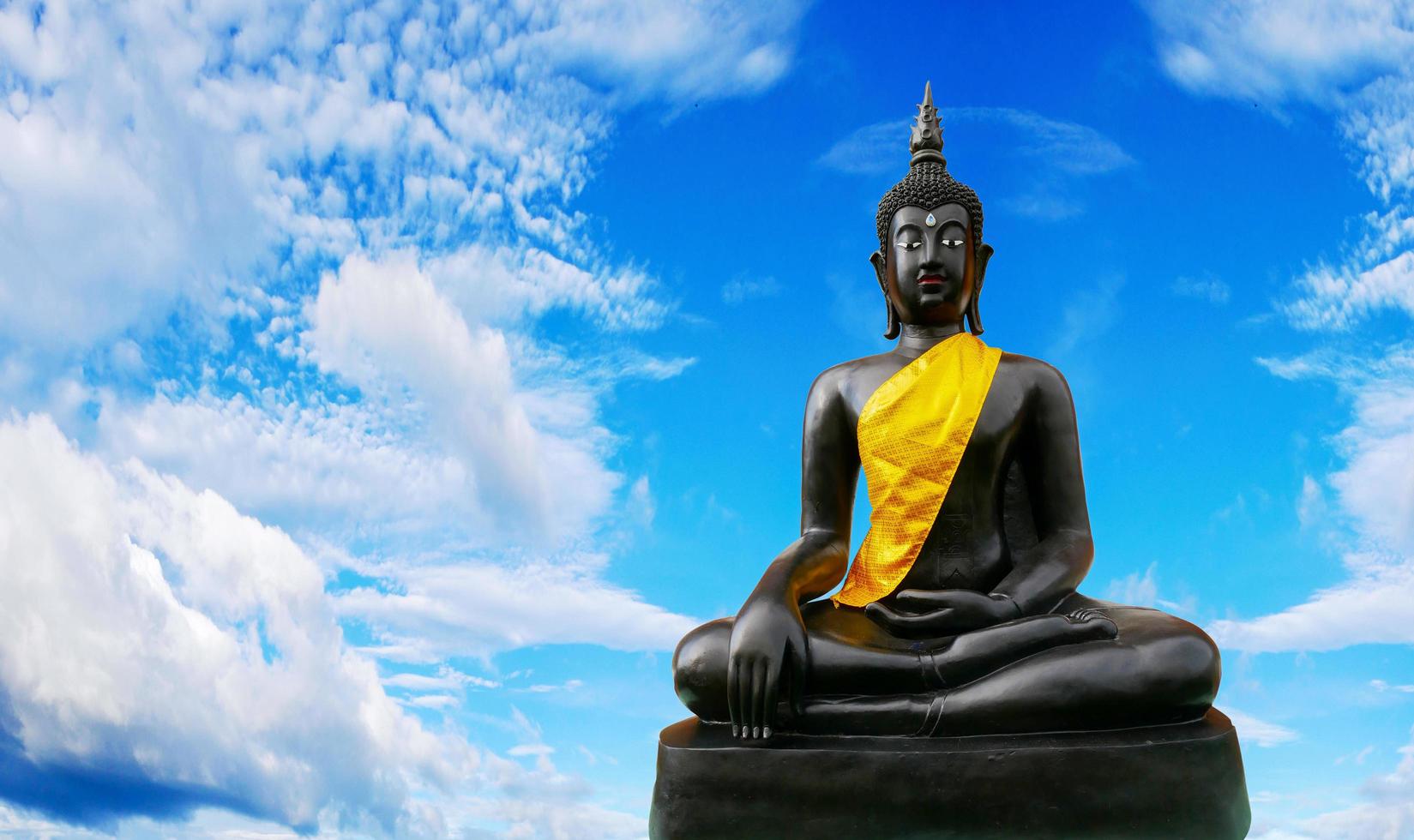 Black buddha on a white background. religious concept photo