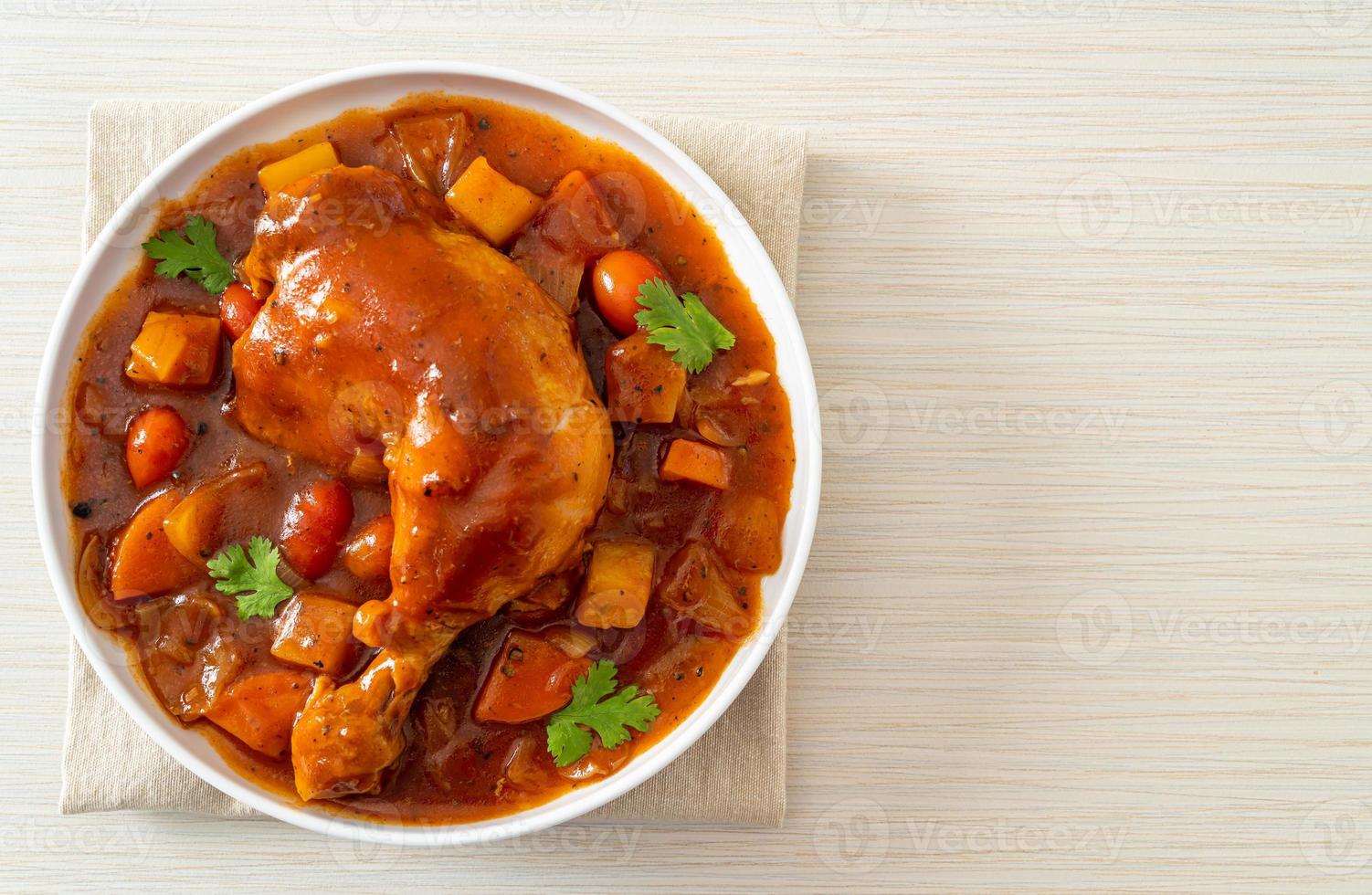 chicken stew with tomatoes, onions, carrot and potatoes photo